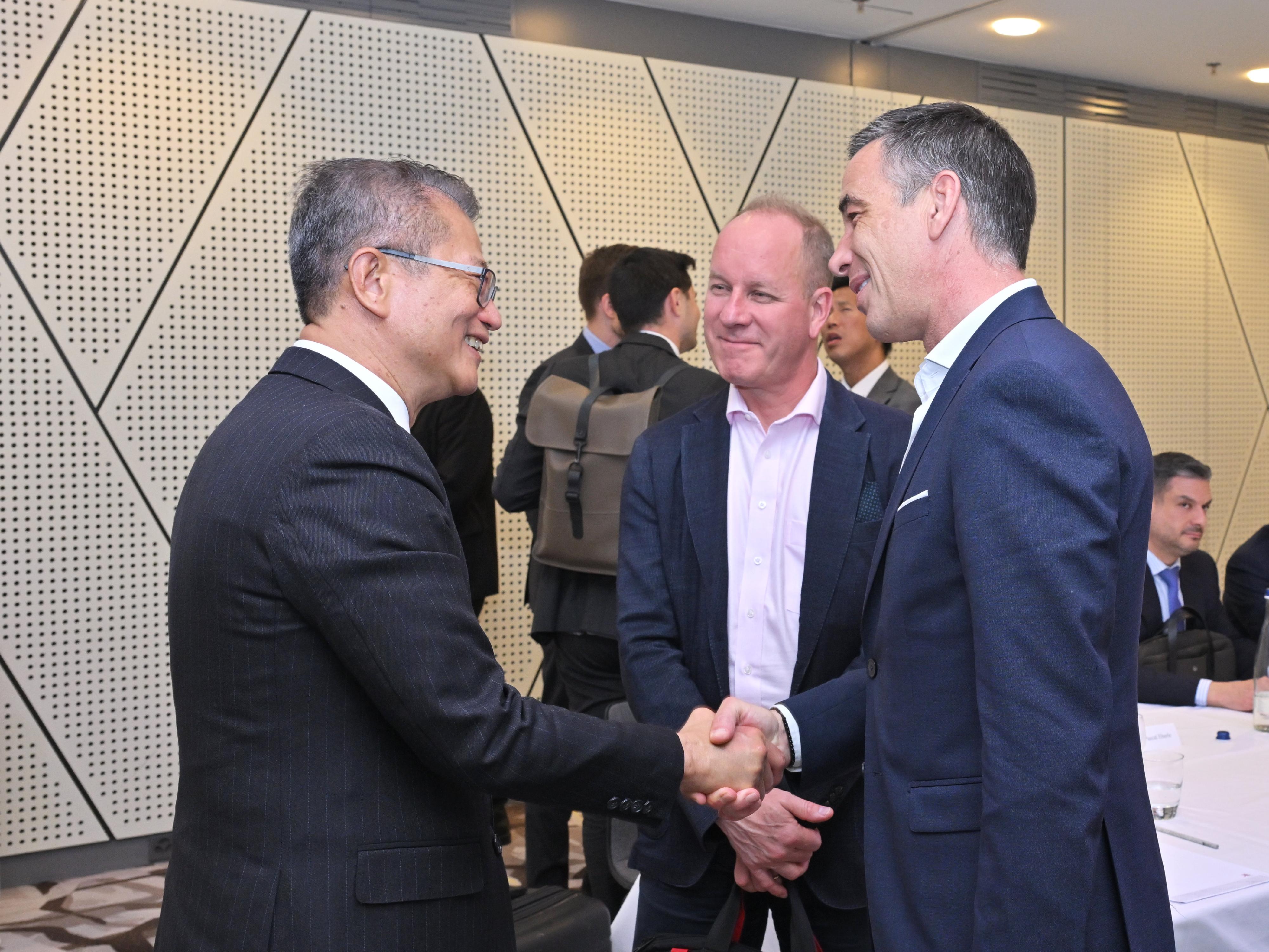 The Financial Secretary, Mr Paul Chan (first left), attended a roundtable meeting with representatives of various banks, asset and wealth management institutions and family offices in Zurich, Switzerland, on May 21 (Zurich time).