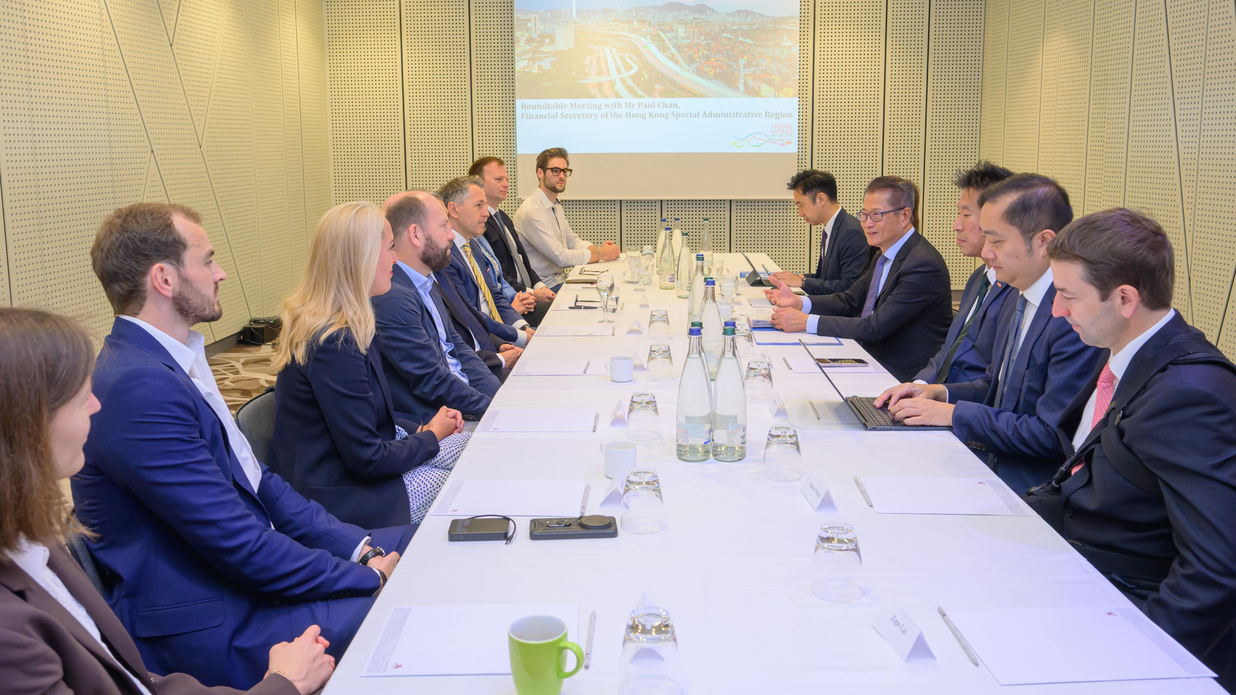 The Financial Secretary, Mr Paul Chan (fourth right), held a roundtable meeting with representatives of local venture capital and private equity funds in Zurich, Switzerland, on May 22 (Zurich time).