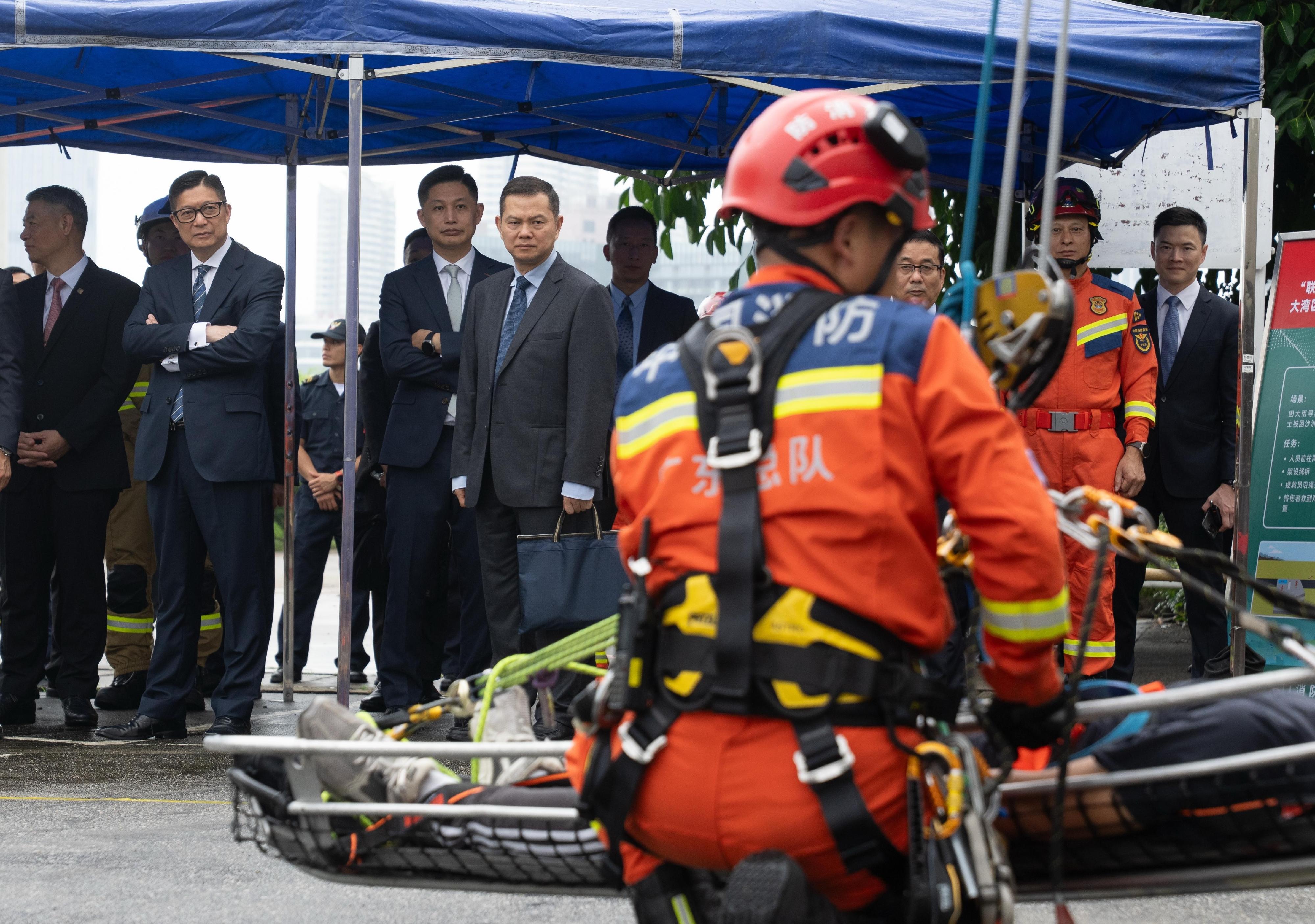 The Guangdong-Hong Kong-Macao Greater Bay Area joint emergency response and rescue exercise, &ldquo;Liancheng-2026&rdquo;, was held in Macao from May 20 to today (May 22). Photo shows the Secretary for Security, Mr Tang Ping-keung (second left), and the Director of Fire Services, Mr Andy Yeung (third left), observing the exercise.