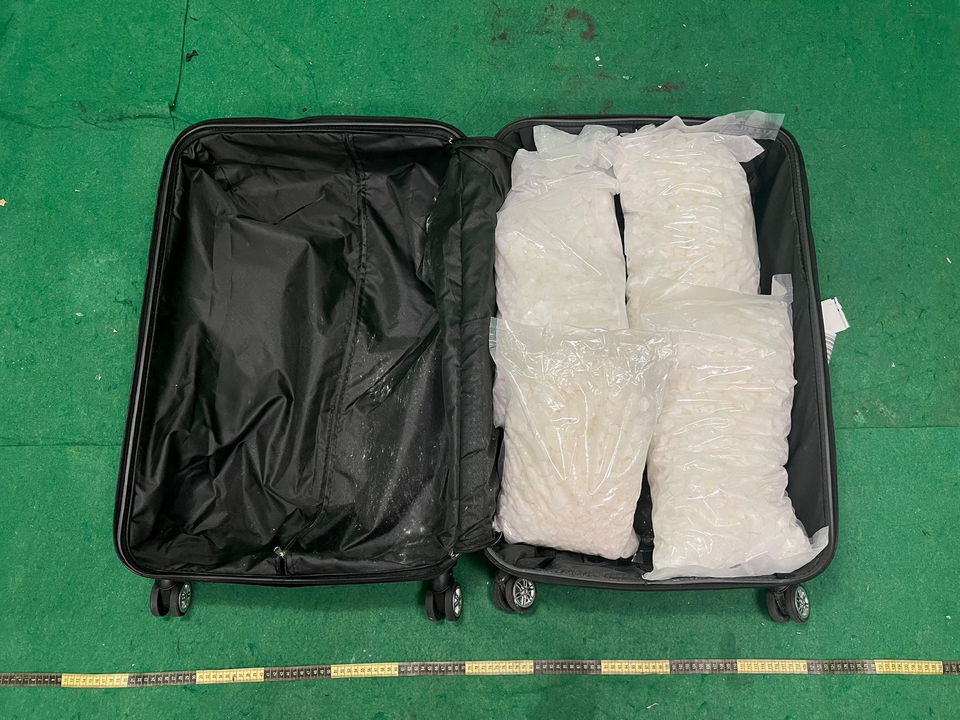 Hong Kong Customs detected two dangerous drugs cases in Tseung Kwan O and Hong Kong International Airport respectively yesterday (May 21) and today (May 22), and seized a total of about 21.8 kilograms of assorted drugs with a total estimated market value of about $7.95 million. Photo shows the suspected ketamine seized in the second case.
