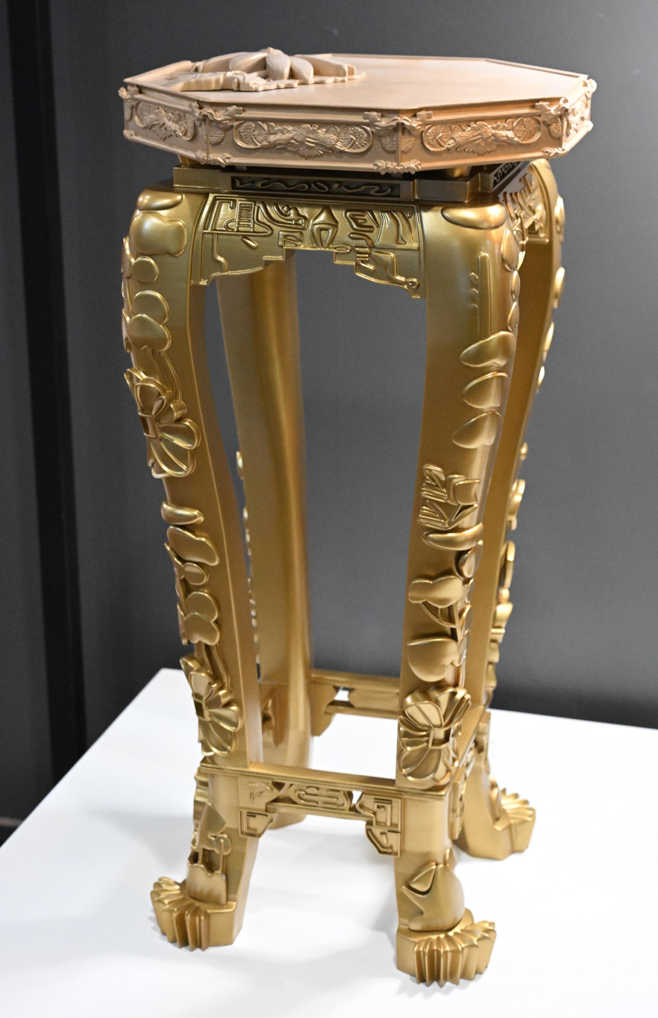 The Hong Kong Heritage Museum is staging "WoW! Hong Kong Design Series II - East-West Design Reflections: Haven Collection's Ming Furniture and a Century of Chair Play" exhibition starting from tomorrow (May 24). Photo shows "Golden Blossom", a 3D-printed flower table by artist Victor Wong, which features carvings of exquisite floral motifs, symbolising wealth and harmony.