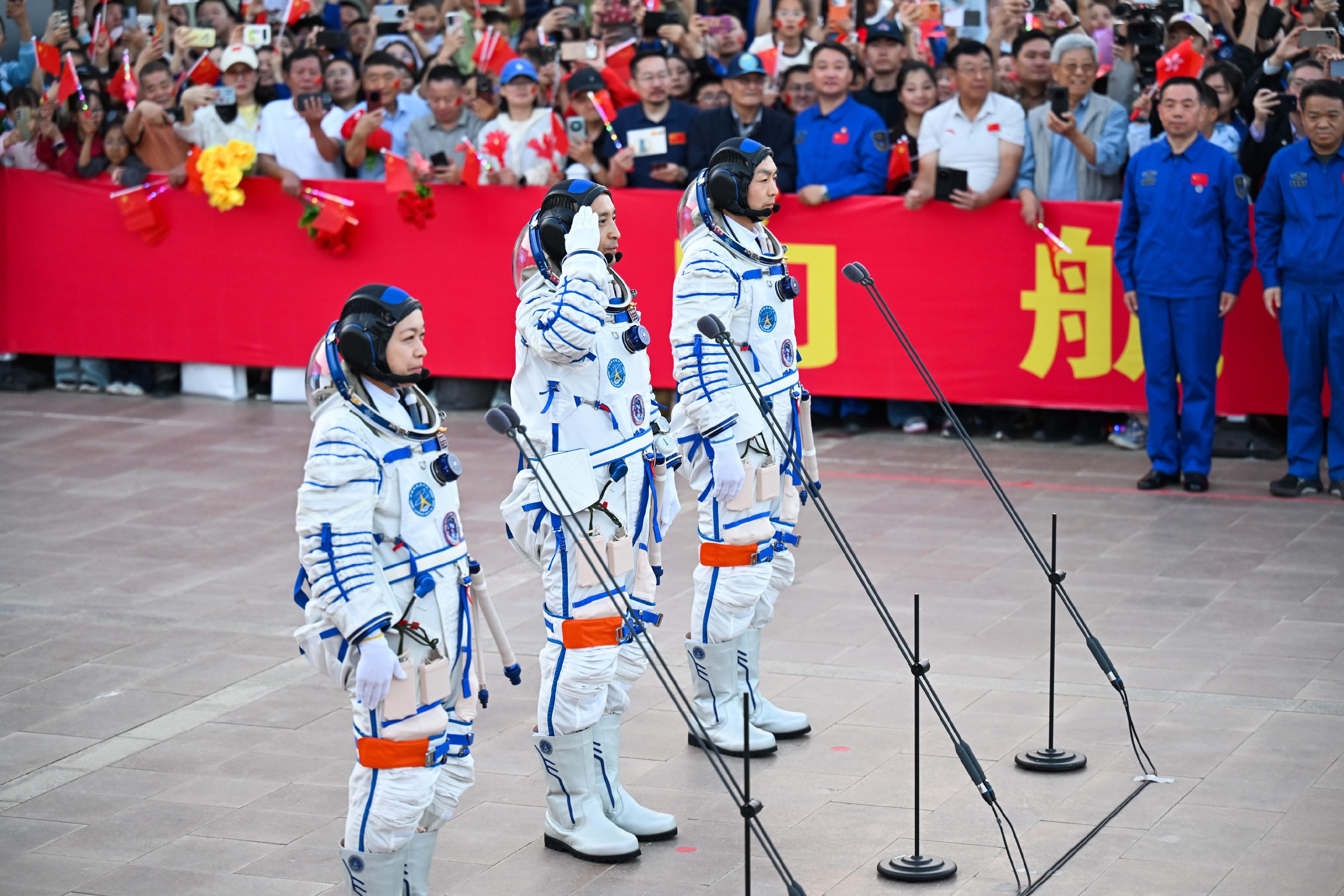 Photo shows crew members of Shenzhou-23 manned spaceflight mission Dr Lai Ka-ying (left), Mr Zhu Yangzhu (centre), and Mr Zhang Zhiyuan (right) attending the send-off ceremony.