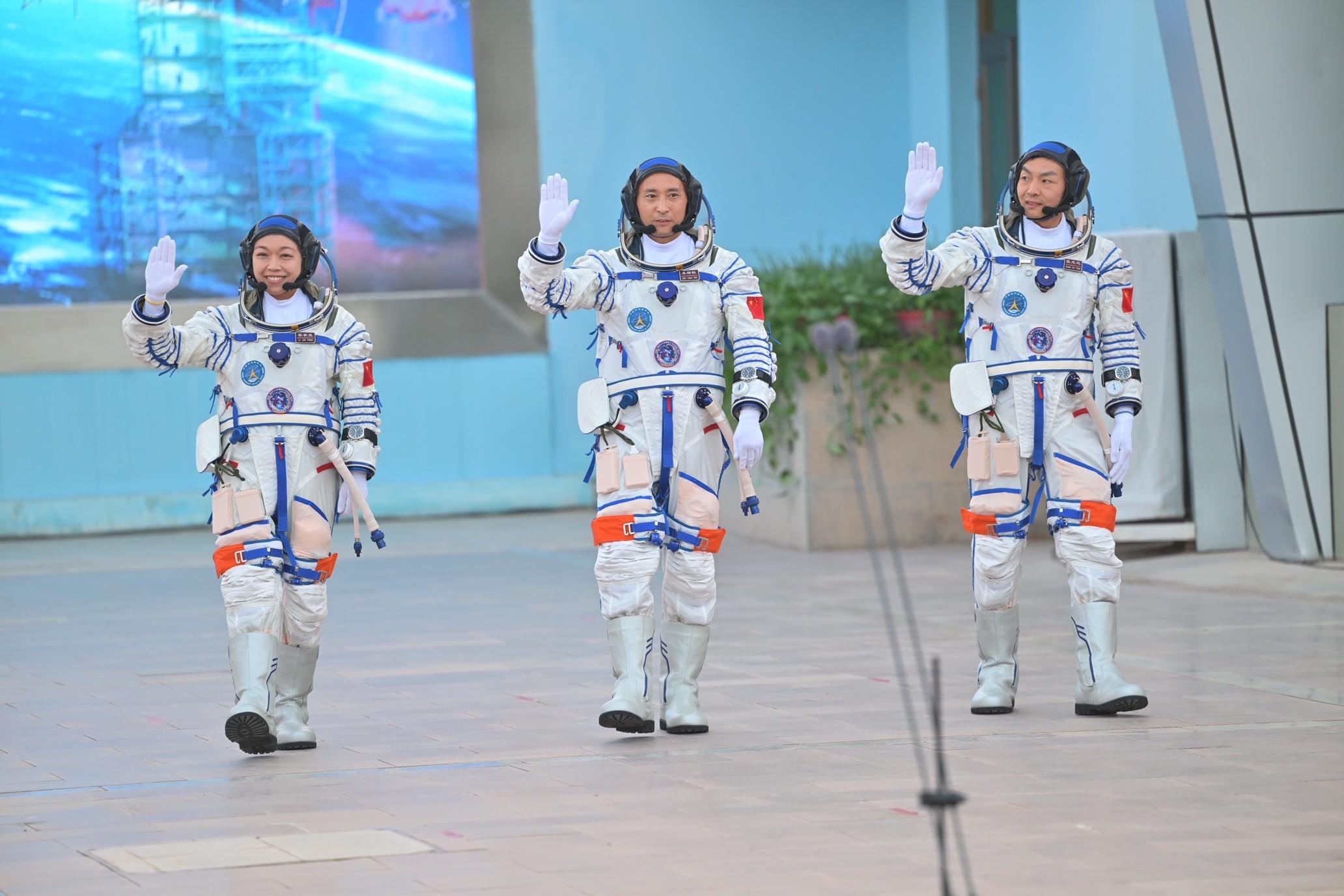 Photo shows crew members of Shenzhou-23 manned spaceflight mission Dr Lai Ka-ying (left), Mr Zhu Yangzhu (centre), and Mr Zhang Zhiyuan (right) attending the send-off ceremony.