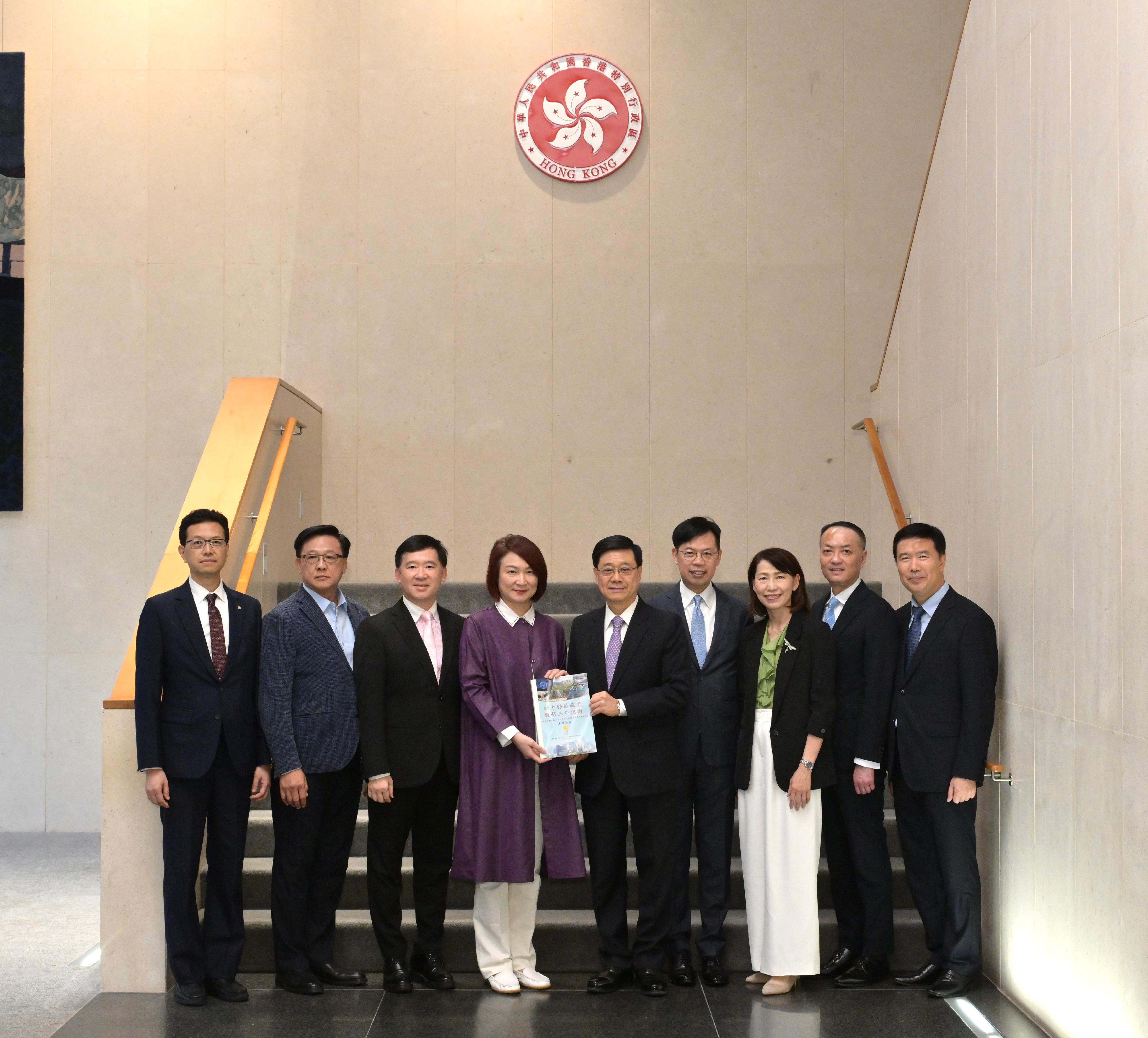 The Chief Executive, Mr John Lee, today (May 29) received the Legislative Council's briefing on its thematic research and views gathered on Hong Kong's five-year plan. Photo shows Mr Lee (centre); the Acting Secretary for Constitutional and Mainland Affairs, Mr Clement Woo (third left); and the Director of the Chief Executive's Office, Ms Carol Yip (third right), with the President of the Legislative Council, Dr Starry Lee (fourth left); the Chairman of the House Committee, Mr Chan Chun-ying (fourth right); the Vice-Chairman of the House Committee, Dr Junius Ho (second left); the Chairman of the Finance Committee, Mr Jimmy Ng (second right); the Chairman of the Subcommittee on Hong Kong's Work to Actively Dovetail with the National 15th Five-Year Plan, Mr Stanley Ng (first left); and the Vice-Chairman of the Subcommittee, Mr Erik Yim (first right).