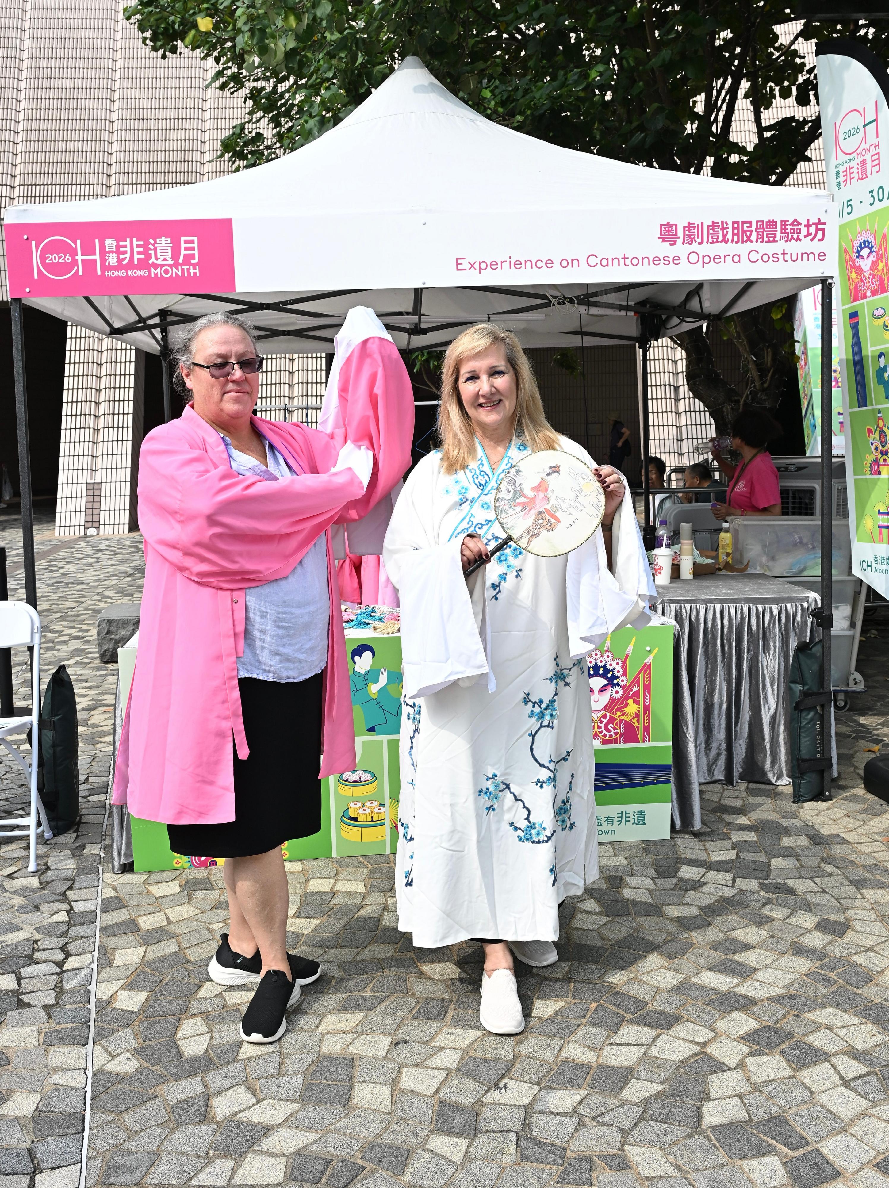 The Hong Kong Jockey Club Series: "Hong Kong ICH Month 2026" Intangible Cultural Heritage Carnival will be held today and tomorrow (May 30 to 31). Photo shows tourists trying on Cantonese opera costumes.
