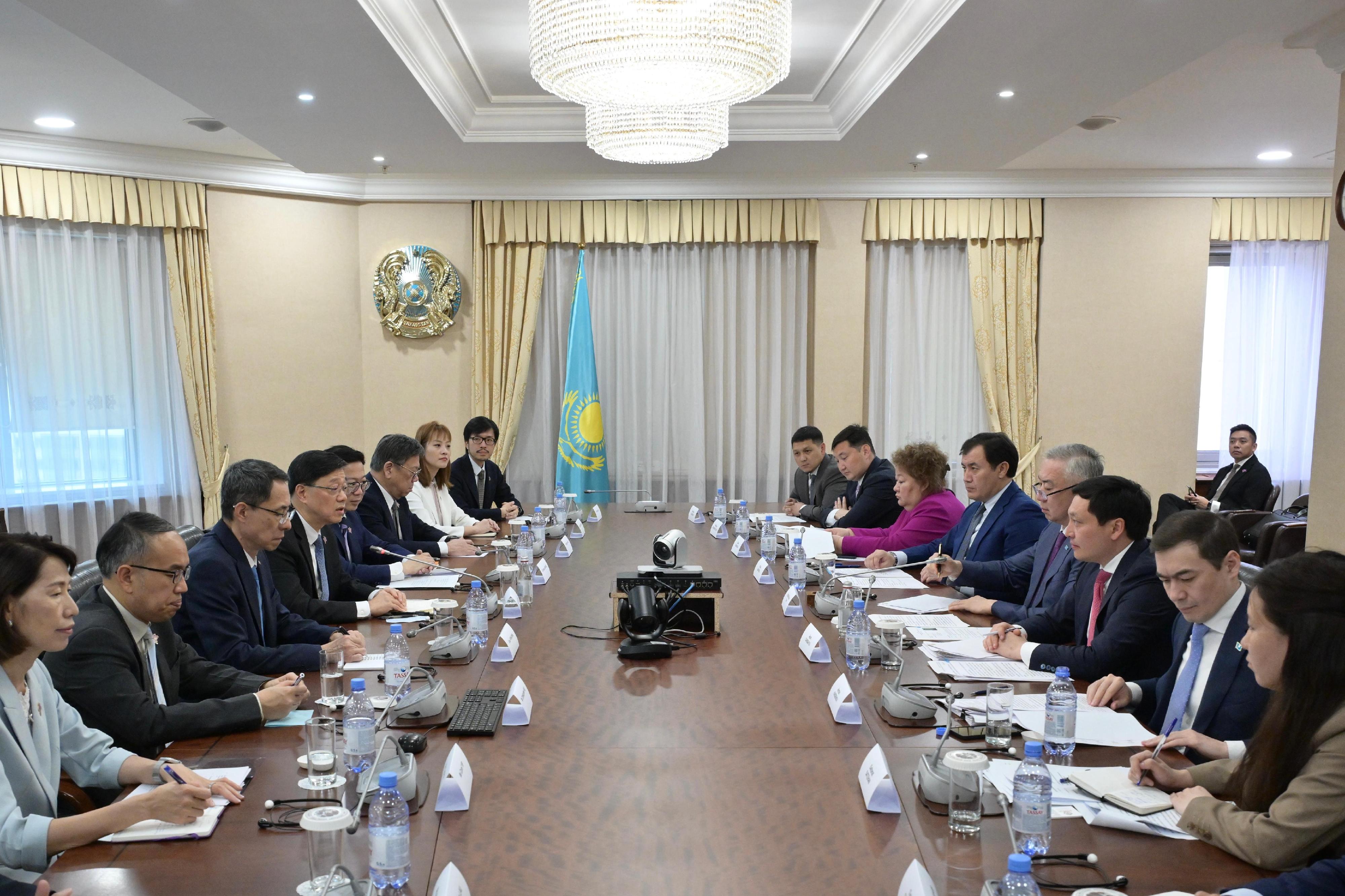 The Chief Executive, Mr John Lee (fourth left), meets with Deputy Prime Minister and Minister of National Economy of Kazakhstan, Mr Serik Zhumangarin (fourth right), in Astana, Kazakhstan, today (June 1, Astana time) to exchange views on deepening economic co-operation between the two places. Looking on are the Ambassador Extraordinary and Plenipotentiary of the People's Republic of China to the Republic of Kazakhstan, Mr Han Chunlin (third left); the Deputy Secretary for Justice, Dr Cheung Kwok-kwan (fifth left); the Secretary for Financial Services and the Treasury, Mr Christopher Hui (second left); the Secretary for Commerce and Economic Development, Mr Algernon Yau (sixth left); the Director of the Chief Executive's Office, Ms Carol Yip (first left); the Under Secretary for Innovation, Technology and Industry, Ms Lillian Cheong (seventh left); and the Commissioner for Belt and Road, Mr Nicholas Ho (eighth left).