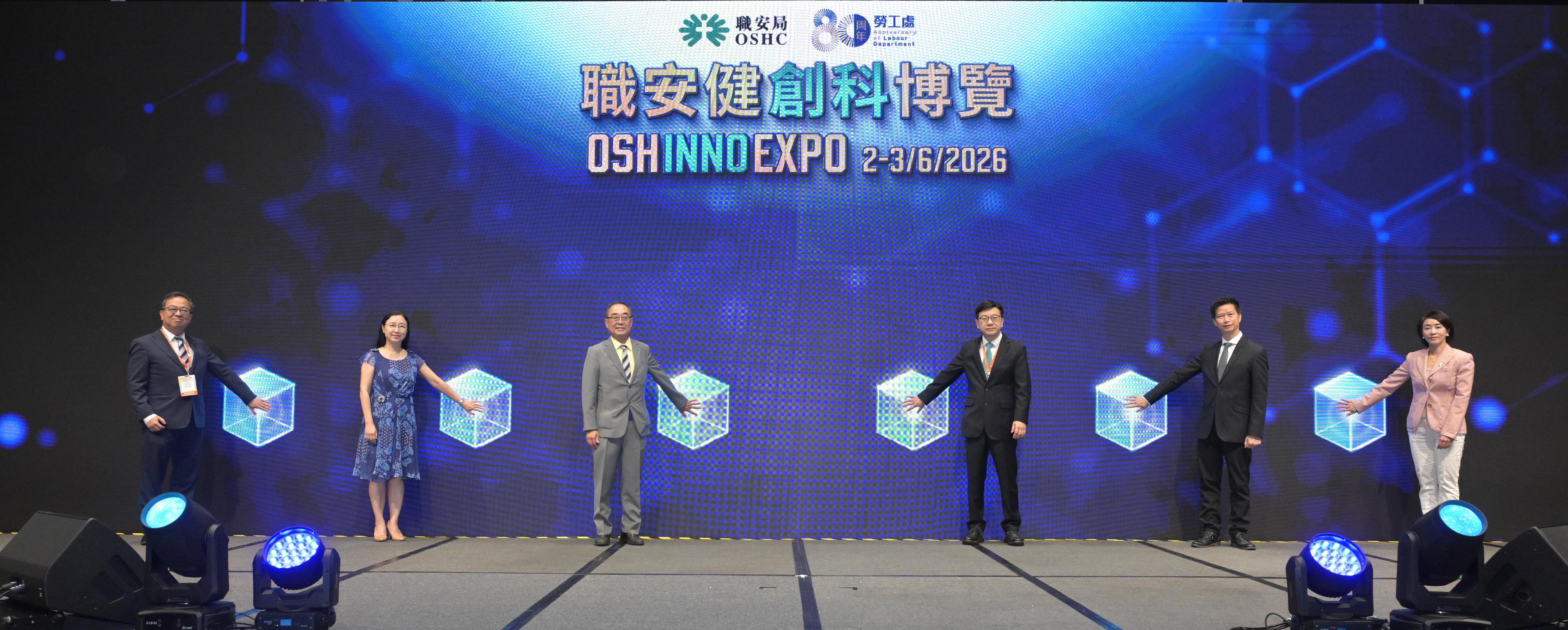 The OSH INNO Expo, jointly organised by the Labour Department and the Occupational Safety and Health Council (OSHC), opened today (June 2). Photo shows the Secretary for Labour and Welfare, Mr Chris Sun (third right); the Permanent Secretary for Labour and Welfare, Ms Alice Lau (second left); the Commissioner for Labour, Mr Sam Hui (second right); the Chairman of the OSHC, Dr David Mong (third left), the Vice-chairman of the OSHC, Professor Lam Chor-yin (first left); and the Chair of OSH Innovation and Information Technology Committee, Mrs Cindy Chow (first right), officiating at the opening ceremony of the Expo.