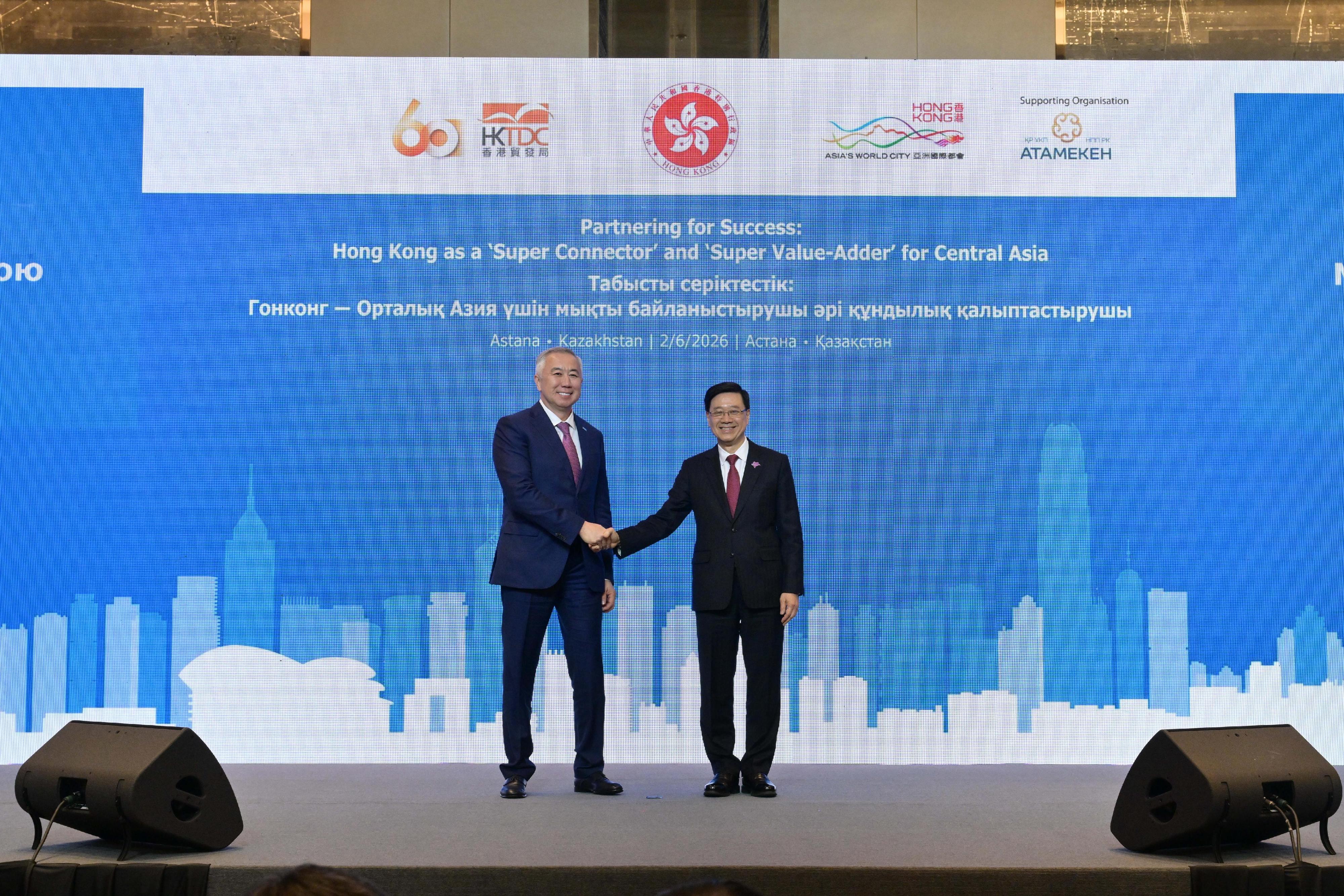 The Chief Executive, Mr John Lee, attended a business luncheon co-organised by the Hong Kong Special Administrative Region Government and the Hong Kong Trade Development Council in Astana, Kazakhstan, today (June 2, Astana time). Photo shows Mr Lee (right) and Deputy Prime Minister and Minister of National Economy of Kazakhstan, Mr Serik Zhumangarin (left), on the stage.