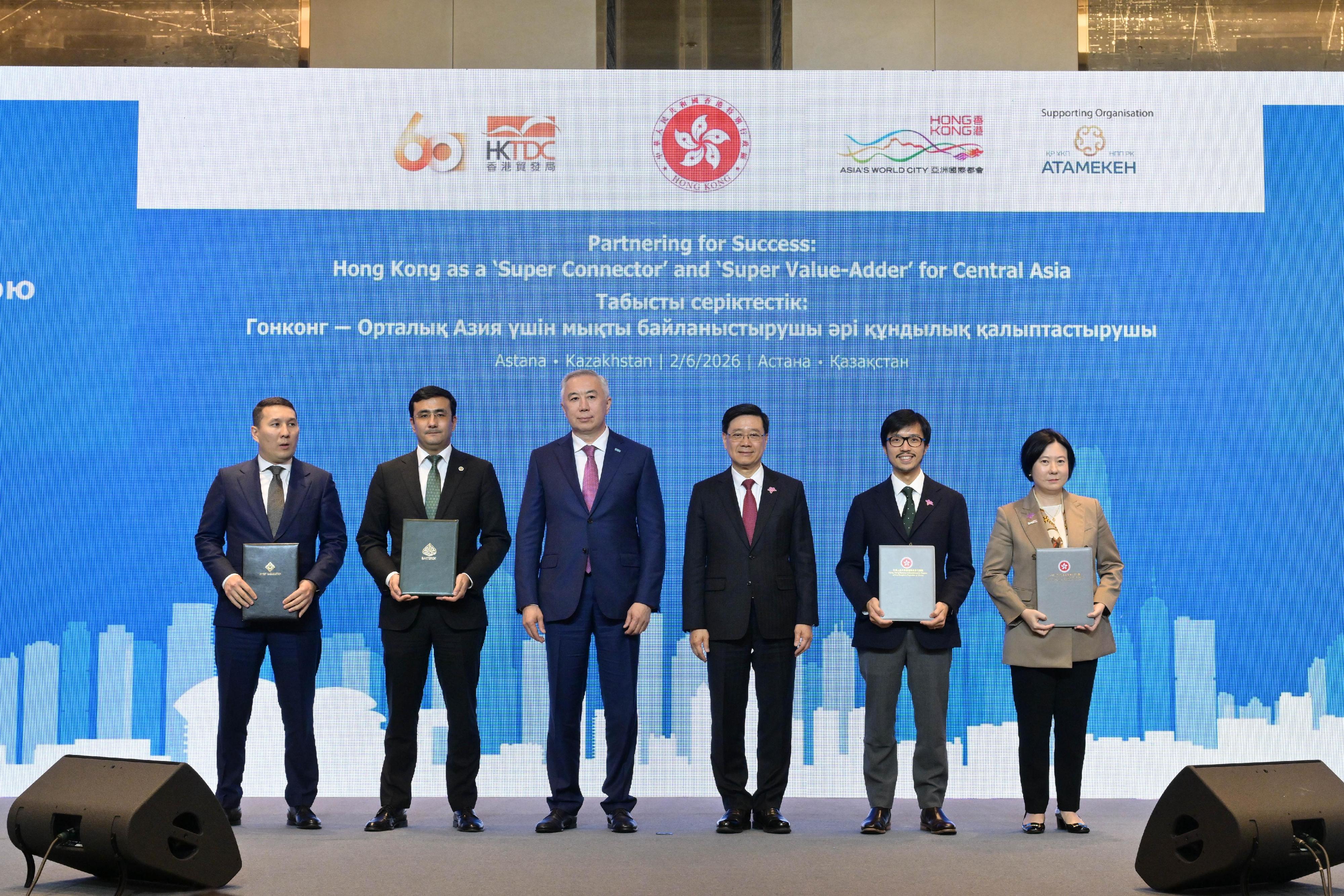 The Chief Executive, Mr John Lee, attended a business luncheon co-organised by the Hong Kong Special Administrative Region Government and the Hong Kong Trade Development Council in Astana, Kazakhstan, today (June 2, Astana time). Photo shows Mr Lee (third right) and Deputy Prime Minister and Minister of National Economy of Kazakhstan, Mr Serik Zhumangarin (third left) witnessing the exchange of Memoranda of Understanding and co-operation agreements between government departments, enterprises and organisations.