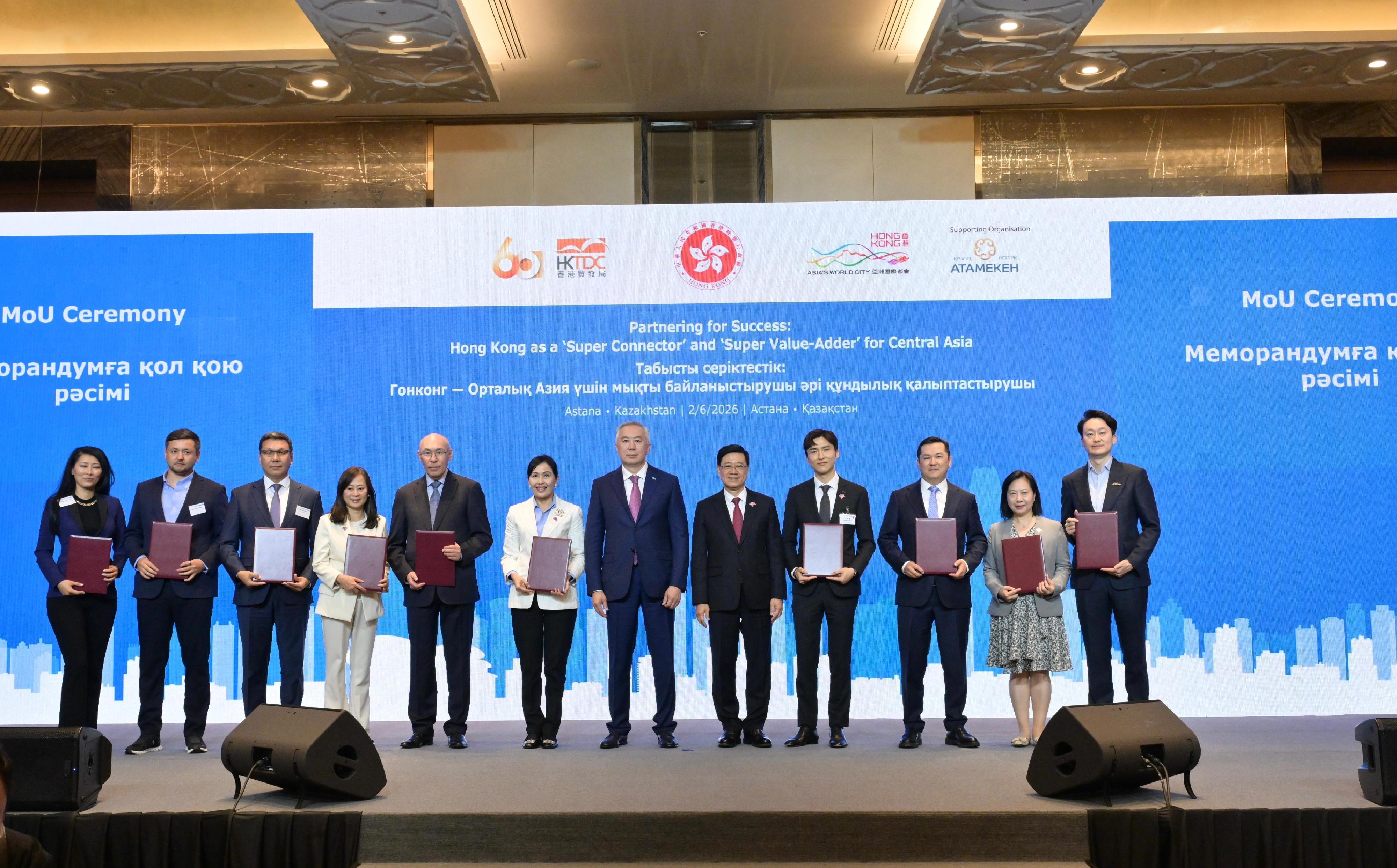 The Chief Executive, Mr John Lee, attended a business luncheon co-organised by the Hong Kong Special Administrative Region Government and the Hong Kong Trade Development Council in Astana, Kazakhstan, today (June 2, Astana time). Photo shows Mr Lee (fifth right) and Deputy Prime Minister and Minister of National Economy of Kazakhstan, Mr Serik Zhumangarin (sixth right) witnessing the exchange of Memoranda of Understanding and co-operation agreements between government departments, enterprises and organisations.