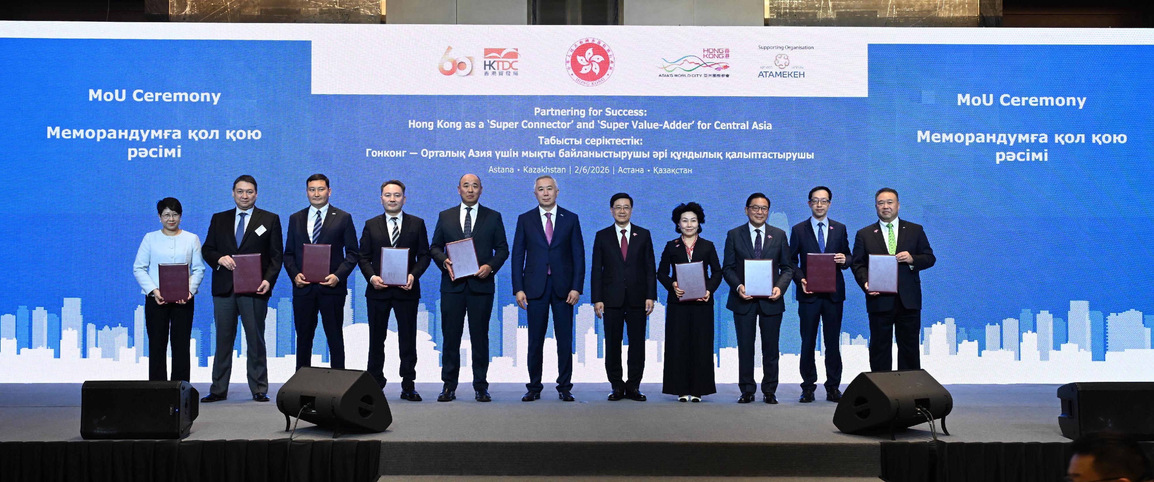 The Chief Executive, Mr John Lee, attended a business luncheon co-organised by the Hong Kong Special Administrative Region Government and the Hong Kong Trade Development Council in Astana, Kazakhstan, today (June 2, Astana time). Photo shows Mr Lee (fifth right) and Deputy Prime Minister and Minister of National Economy of Kazakhstan, Mr Serik Zhumangarin (centre) witnessing the exchange of Memoranda of Understanding and co-operation agreements between government departments, enterprises and organisations.
