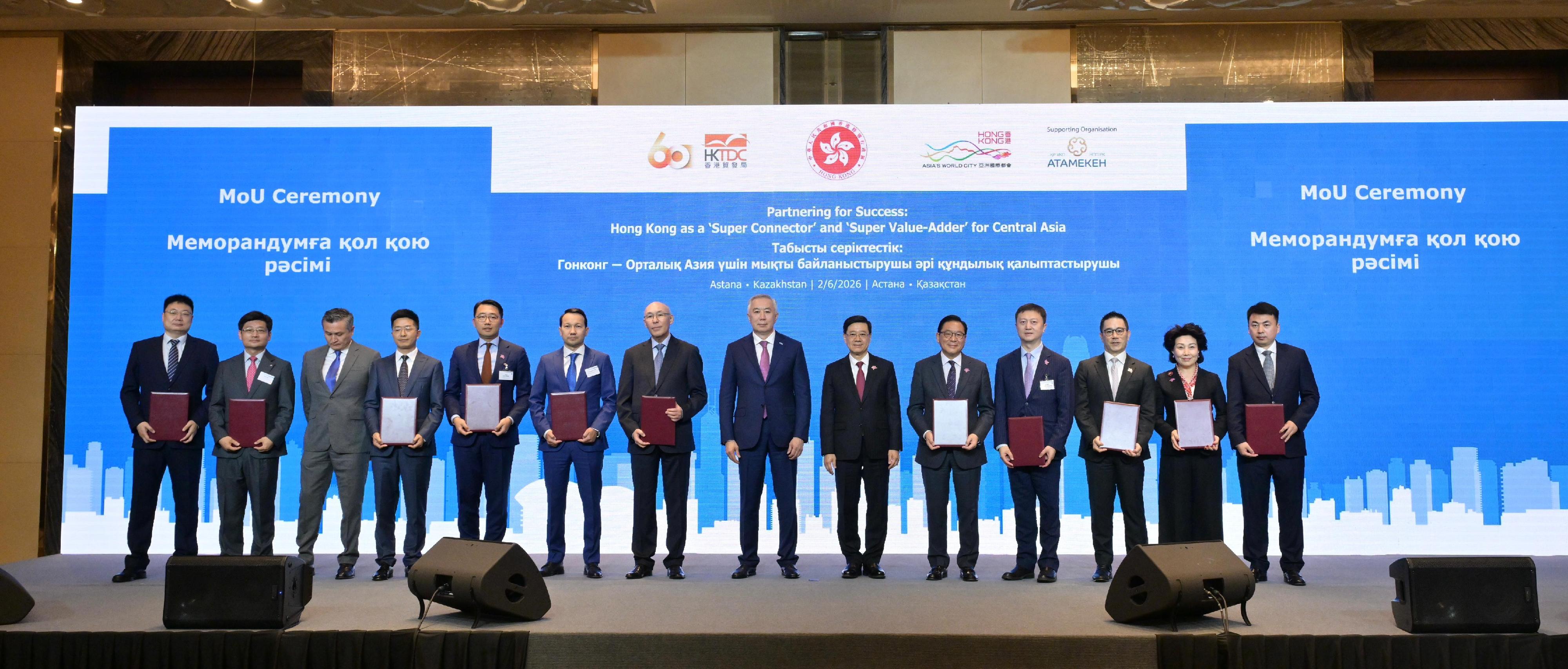 The Chief Executive, Mr John Lee, attended a business luncheon co-organised by the Hong Kong Special Administrative Region Government and the Hong Kong Trade Development Council in Astana, Kazakhstan, today (June 2, Astana time). Photo shows Mr Lee (sixth right) and Deputy Prime Minister and Minister of National Economy of Kazakhstan, Mr Serik Zhumangarin (seventh right) witnessing the exchange of Memoranda of Understanding and co-operation agreements between government departments, enterprises and organisations.