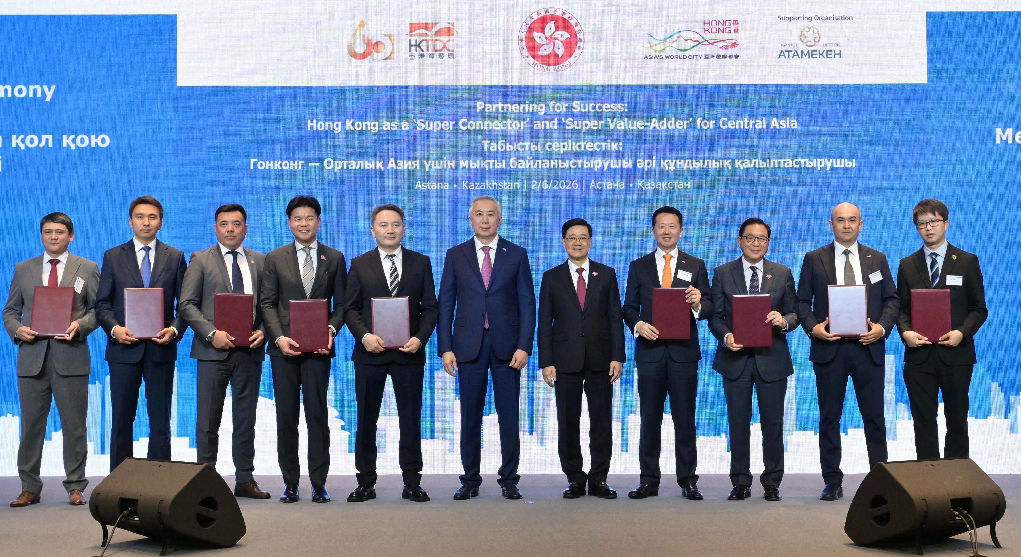 The Chief Executive, Mr John Lee, attended a business luncheon co-organised by the Hong Kong Special Administrative Region Government and the Hong Kong Trade Development Council in Astana, Kazakhstan, today (June 2, Astana time). Photo shows Mr Lee (fifth right) and Deputy Prime Minister and Minister of National Economy of Kazakhstan, Mr Serik Zhumangarin (centre) witnessing the exchange of Memoranda of Understanding and co-operation agreements between government departments, enterprises and organisations.