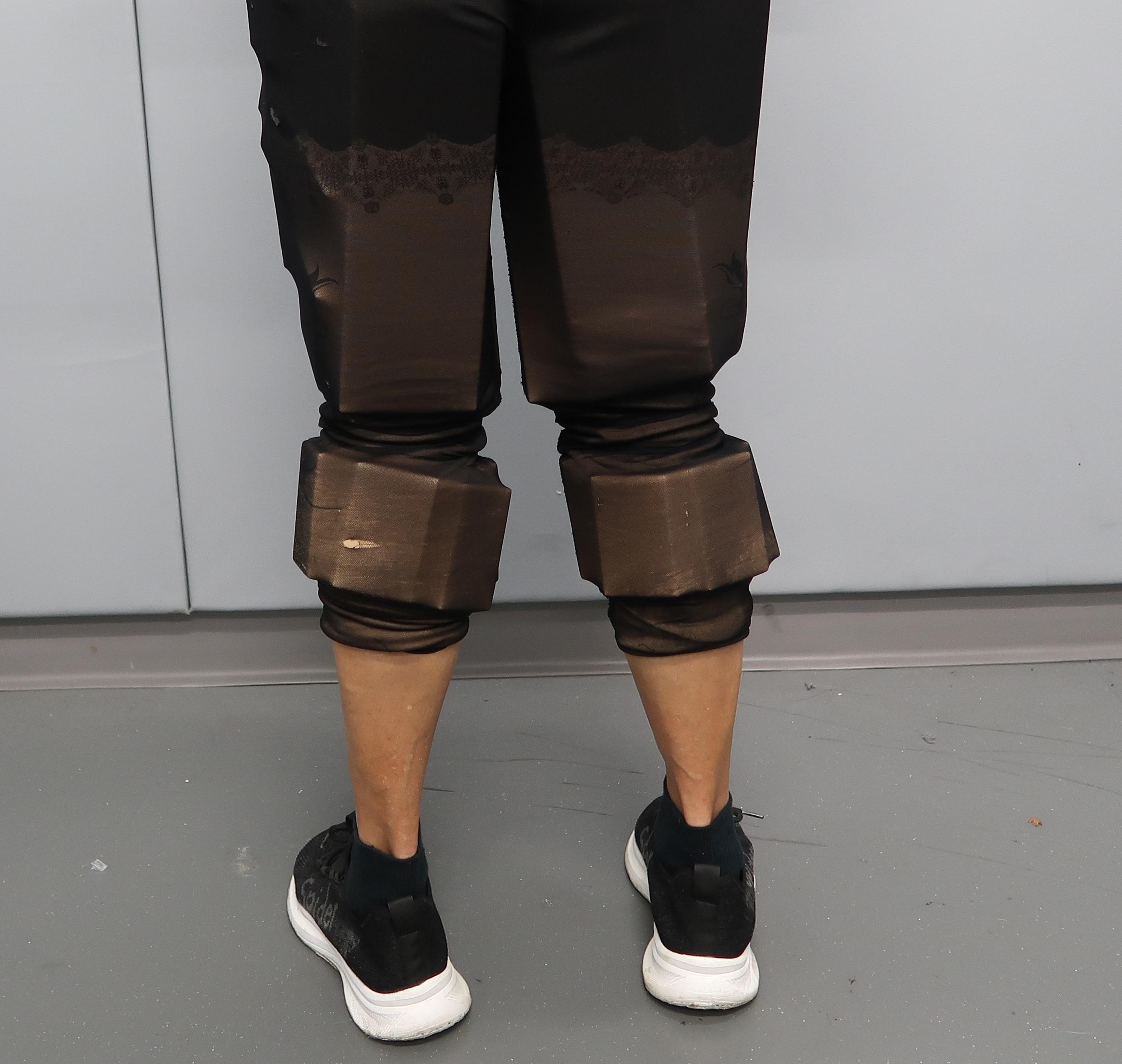 An incoming passenger was sentenced to four weeks' imprisonment with a fine of $1,000 by the Fanling Magistrates' Courts today (June 4) for possessing duty-not-paid cigarettes and failing to declare them to Customs officers, in contravention of the Dutiable Commodities Ordinance. Photo shows the 74-year-old incoming female passenger concealing duty-not-paid cigarettes around her thighs and calves.