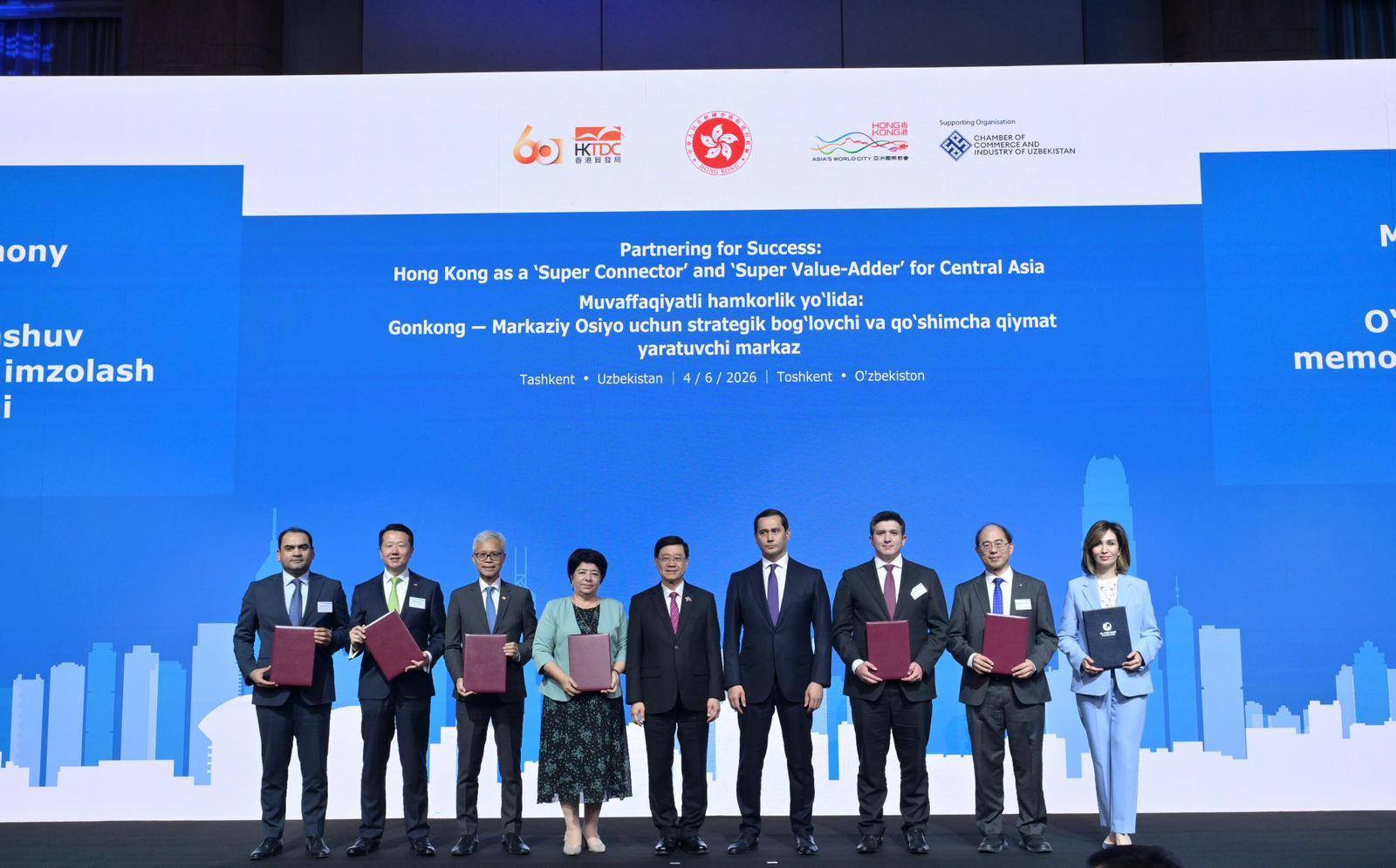 The Chief Executive, Mr John Lee, attended a business dinner and a signing ceremony for Memoranda of Understanding (MOUs) jointly organised by the Hong Kong Special Administrative Region Government and the Hong Kong Trade Development Council in Tashkent, Uzbekistan, today (June 4). Photo shows Mr Lee (centre) and the Advisor to the President of Uzbekistan on Strategic Development, Mr Sardor Umurzakov (fourth right) witnessing the exchange of MOUs and co-operation agreements between government departments, enterprises and organisations.