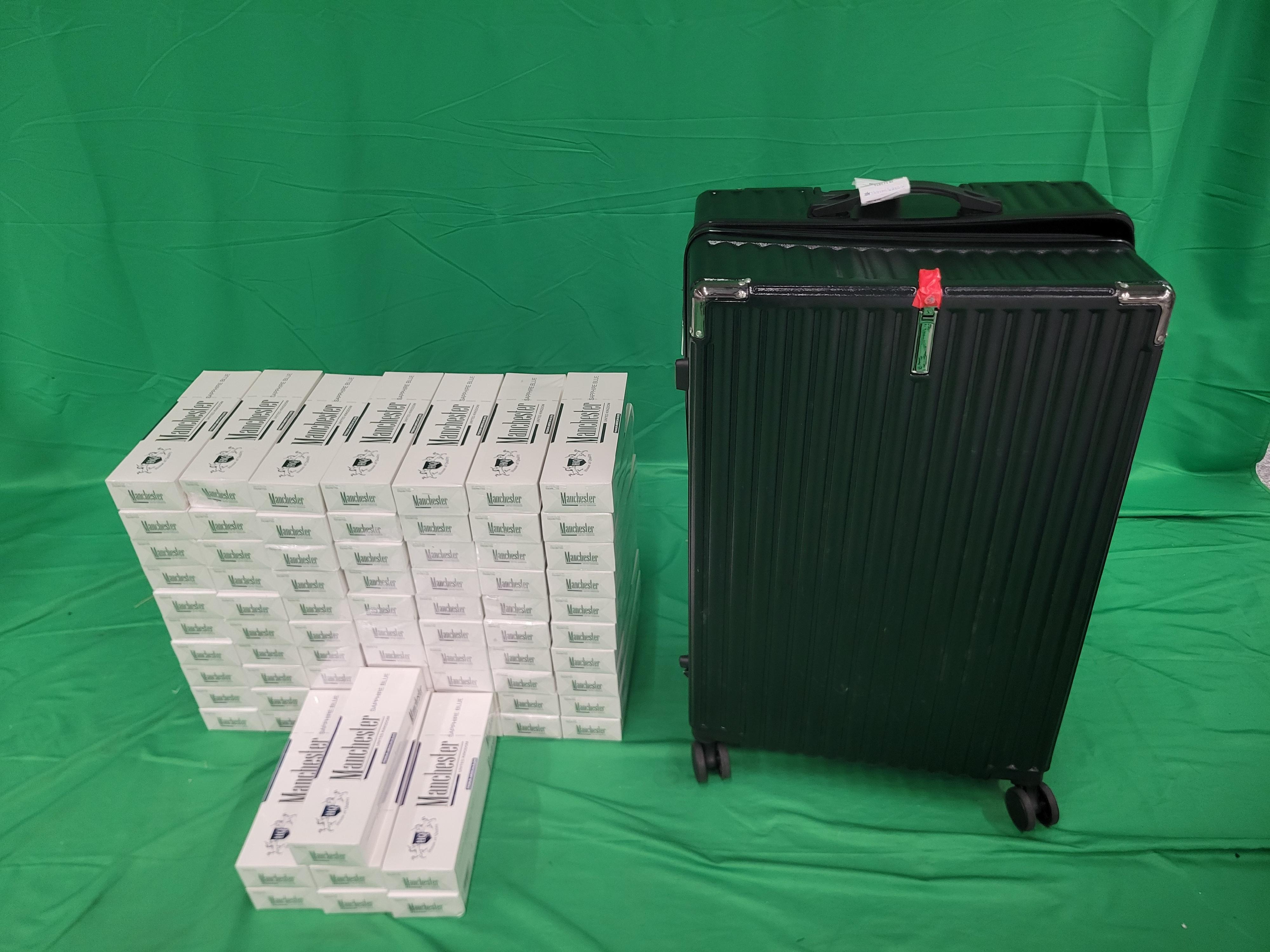 An incoming passenger was sentenced to two months' imprisonment and fined $1,000 by the West Kowloon Magistrates' Courts today (June 5) for importing duty-not-paid cigarettes and failing to declare them to Customs officers, in contravention of the Dutiable Commodities Ordinance. Photo shows the duty-not-paid cigarettes seized from the personal baggage of the 35-year-old incoming male passenger.