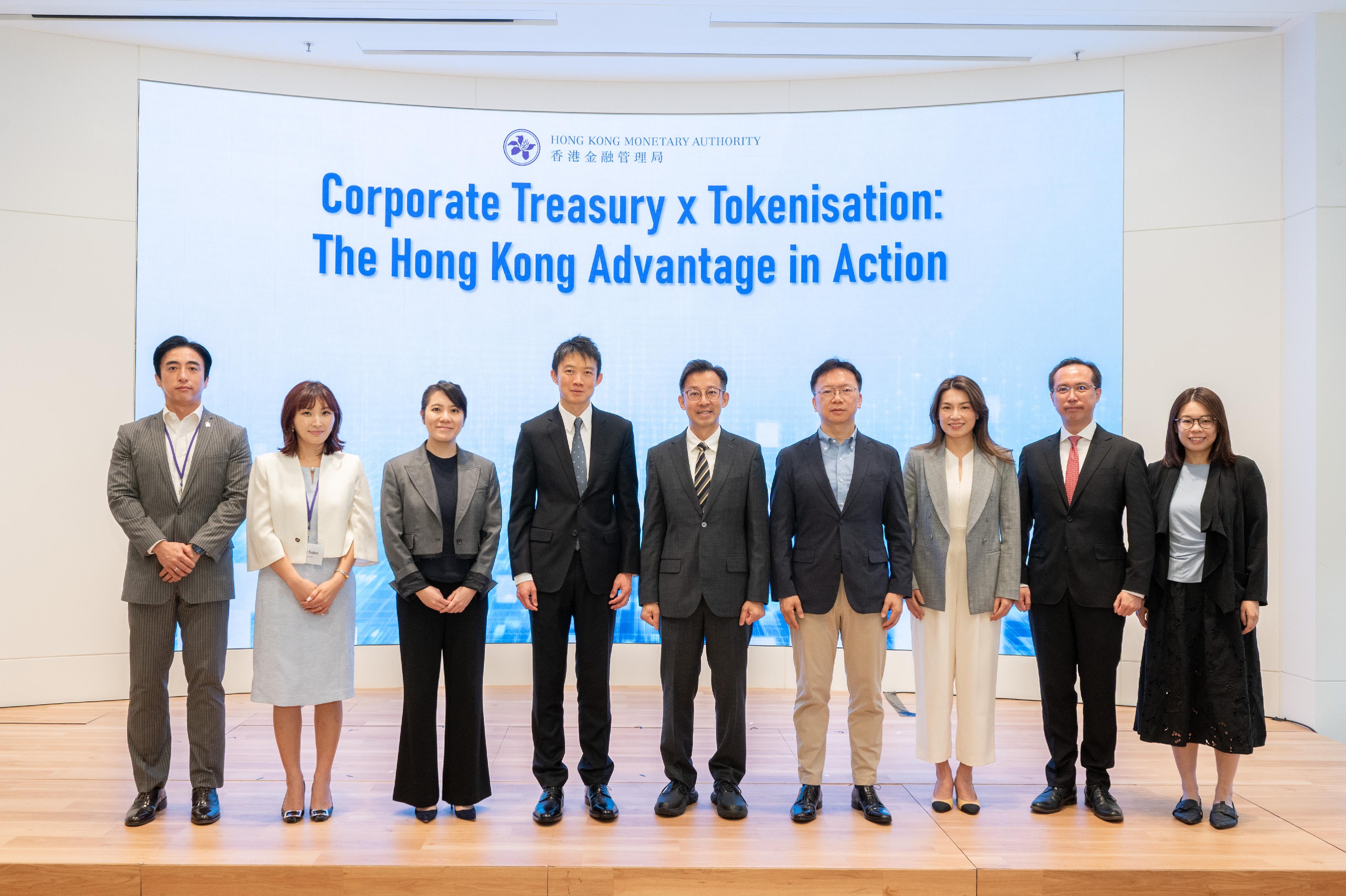 The Hong Kong Monetary Authority (HKMA) organised a seminar on Corporate Treasury x Tokenisation: The Hong Kong Advantage in Action earlier this week. Photo shows the Executive Director (External) of the Hong Kong Monetary Authority (HKMA),Mr Kenneth Hui (fourth left); the Head (Market Development) of the HKMA, Ms Georgina Lok (third left); the Chief Fintech Officer of the HKMA, Mr George Chou (fifth left); and panel speakers attend the seminar.