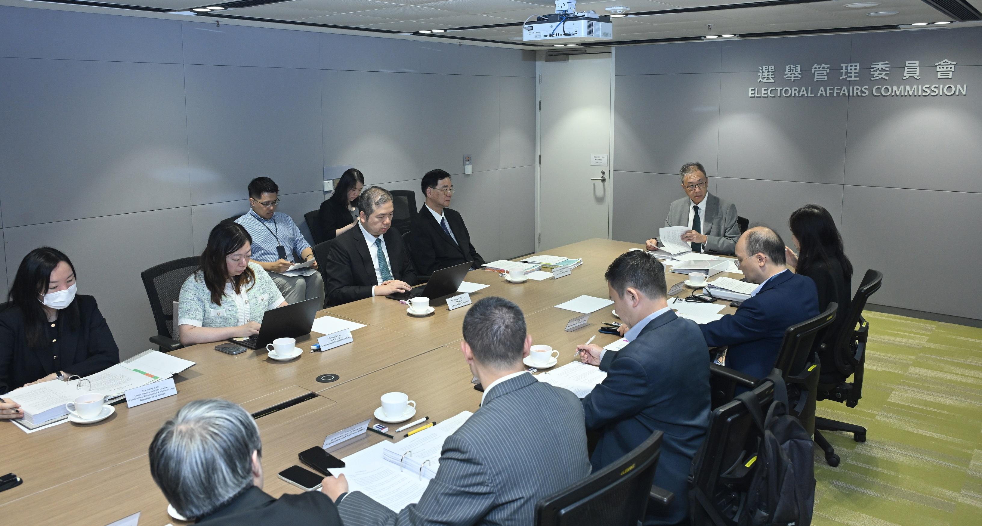 The Chairman of the Electoral Affairs Commission (EAC), Mr Justice David Lok (seventh left), chaired an EAC meeting earlier to discuss the proposed guidelines on election-related activities in respect of the Election Committee Subsector Elections. Also attending the meeting were EAC members Professor Daniel Shek (sixth left) and Mr Bernard Man, SC (fifth left), and the Chief Electoral Officer of the Registration and Electoral Office, Mr Herman Tse (second right).
