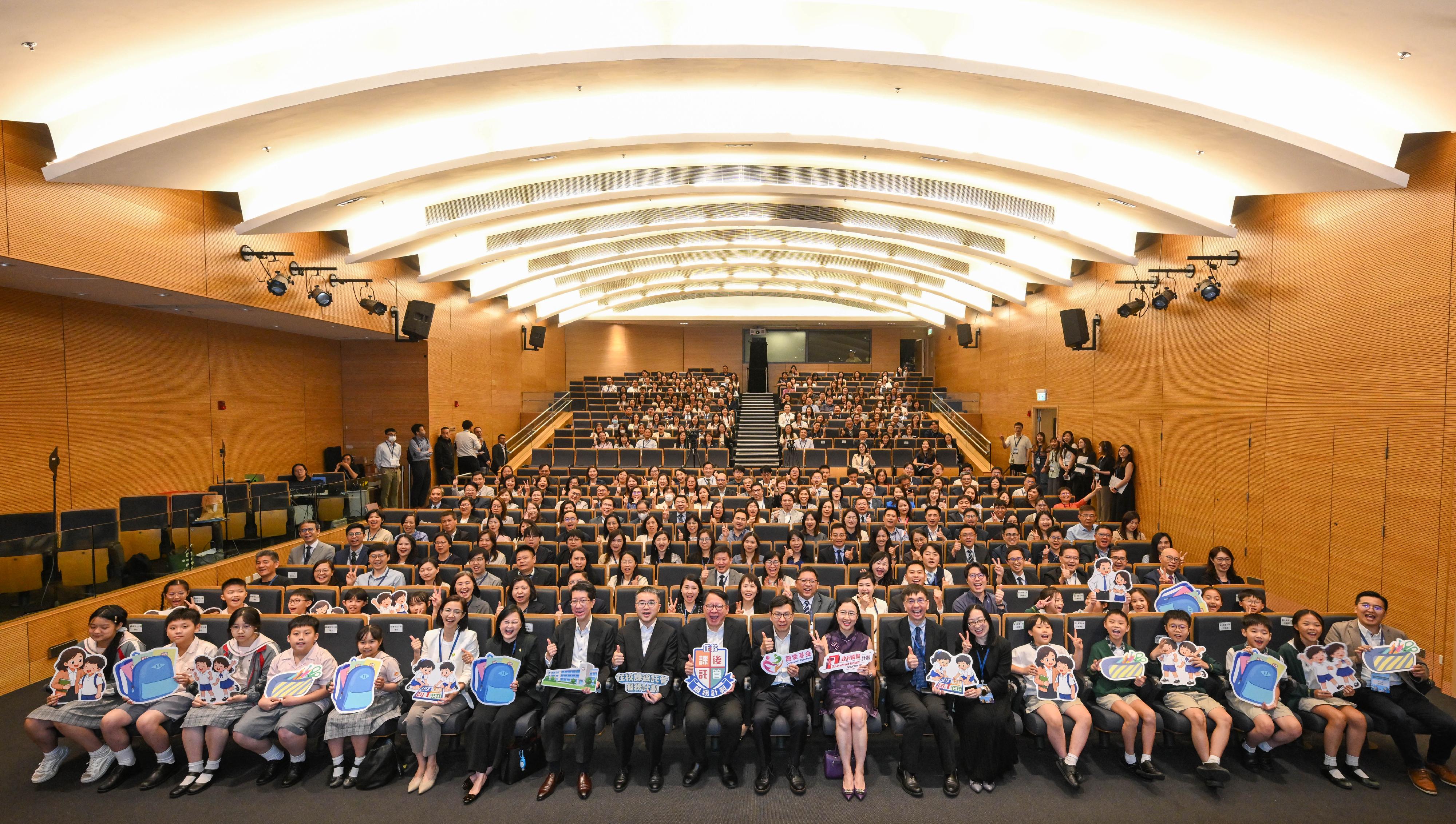 The School-based After School Care Service Scheme commendation ceremony and 2026/27 school year launching ceremony was held today (June 11). Photo shows the Chief Secretary for Administration, Mr Chan Kwok-ki (first row, tenth left); the Secretary for Labour and Welfare, Mr Chris Sun (first row, tenth right); the Permanent Secretary for Labour and Welfare, Ms Alice Lau (first row, ninth right); the Under Secretary for Education, Dr Sze Chun-fai (first row, ninth left); the Director of Social Welfare, Mr Edward To (first row, eighth left), with all other guests.