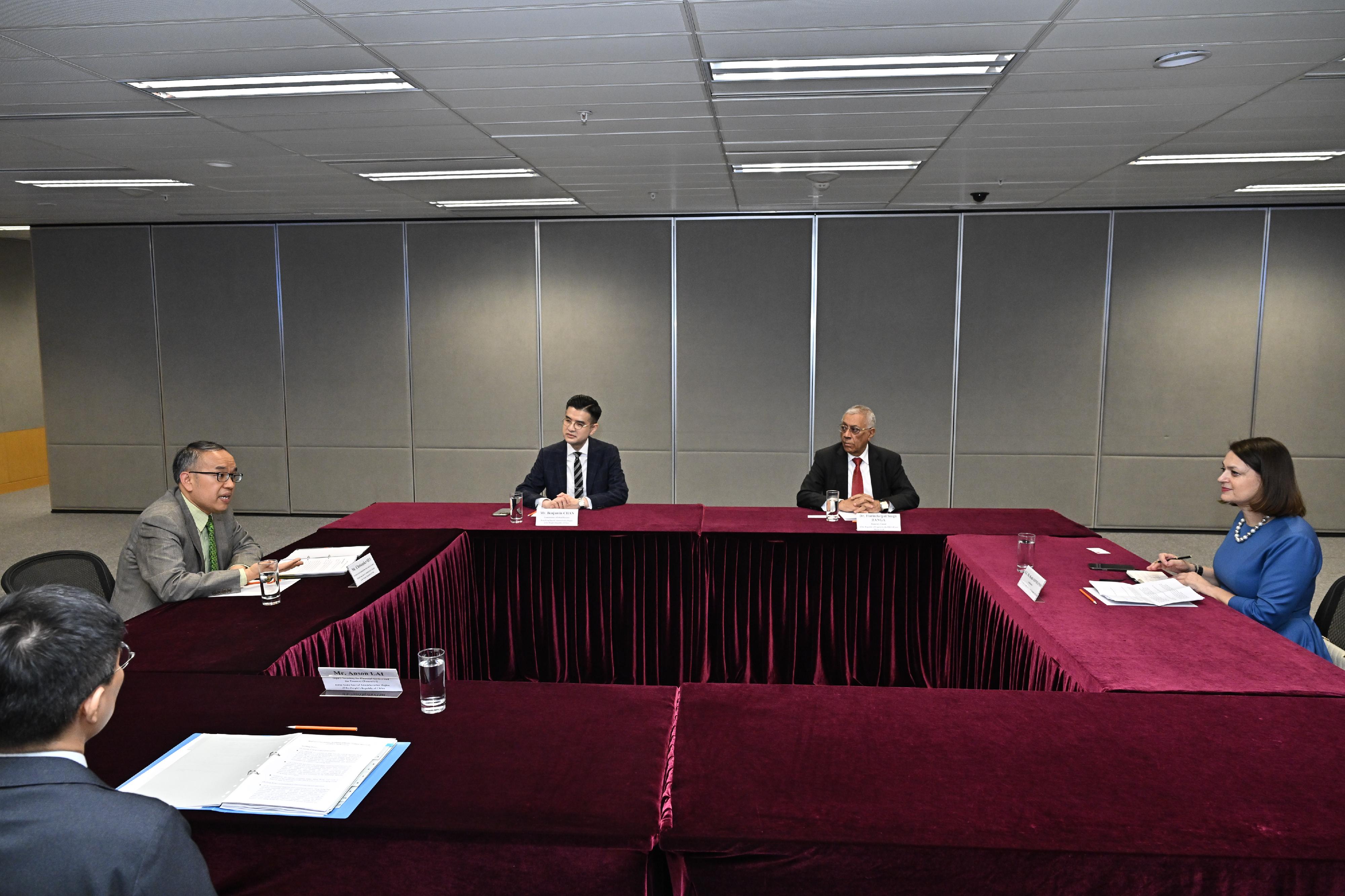 The Secretary for Financial Services and the Treasury, Mr Christopher Hui (second left), and the Ambassador of the Republic of Cyprus to China, Ms Koula Sophianou (first right), have a bilateral meeting today (June 12). Mr Hui highlights to Ms Sophianou the advantages of Hong Kong as an international financial centre and its latest developments, including its rise to become the world's largest cross-boundary wealth management centre and the efforts made to build an international gold trading market in Hong Kong.