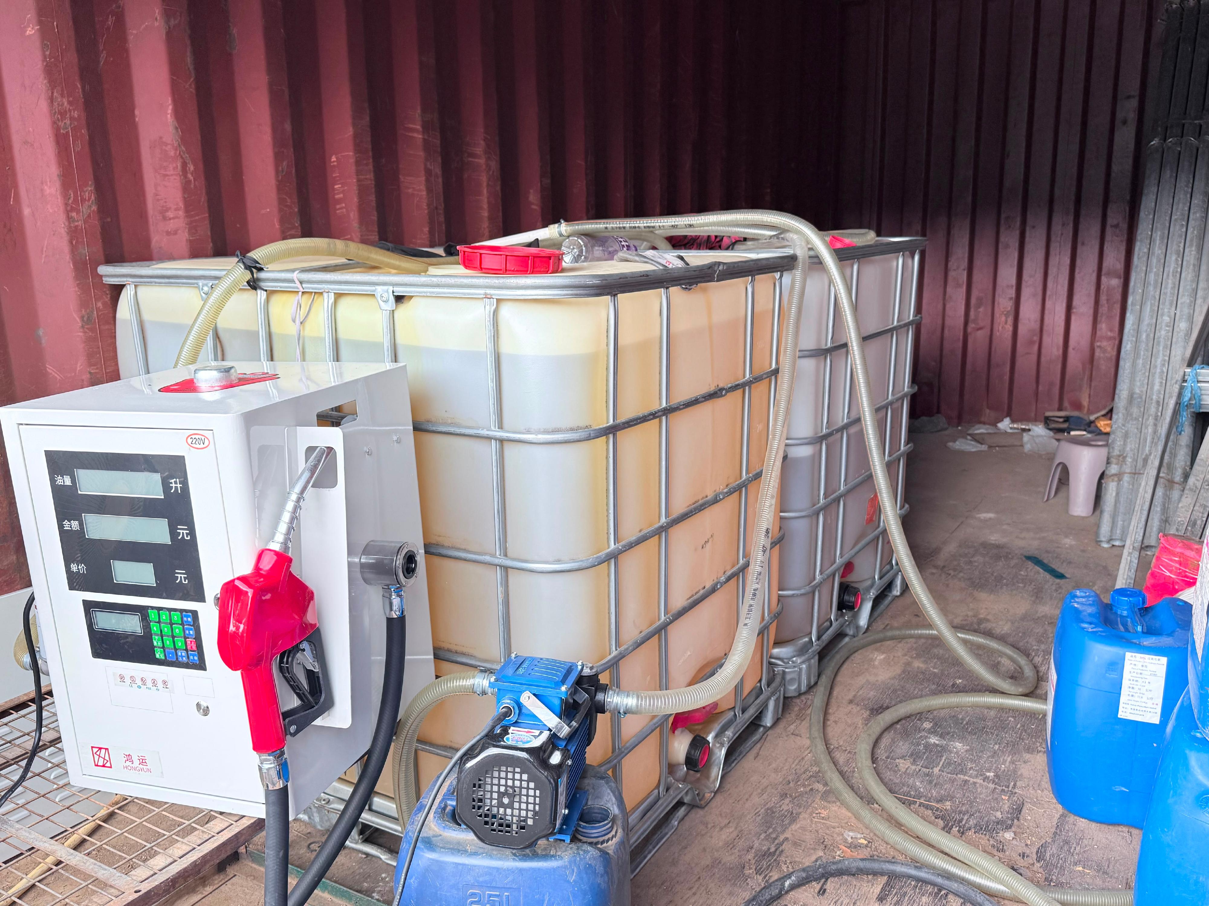 Hong Kong Customs and the Fire Services Department mounted a territory-wide operation targeting illicit fuel activities on June 10. During the operation, officers of the two departments detected two related cases and seized about 3 200 litres of illicit motor spirit, with an estimated market value of about $104,000 and a duty potential of about $20,000. Two persons were arrested, and one vehicle connected with one of the cases was also seized. Two persons were arrested, and one vehicle connected with one of the cases was also seized. Photo shows an illegal fuelling station raided in Tung Chung.