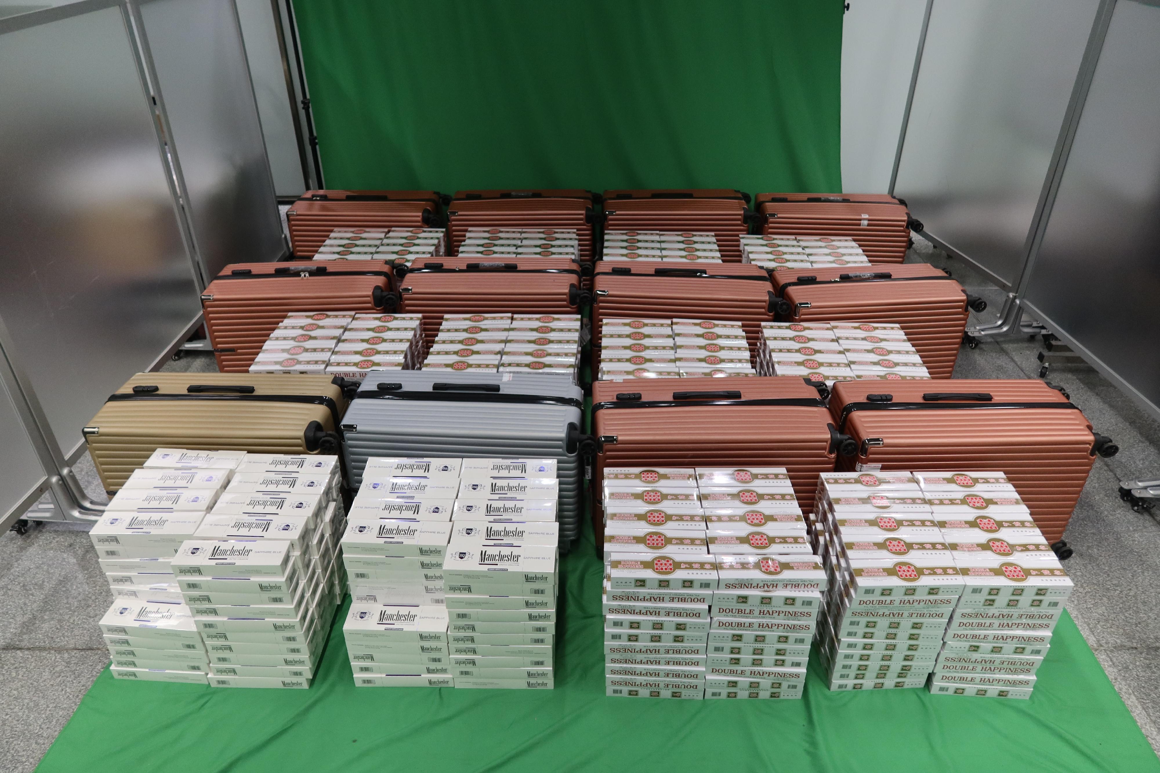 Two incoming male passengers were each sentenced to 10 months' imprisonment and fined $1,000 by the West Kowloon Magistrates' Courts today (June 12) for importing duty-not-paid cigarettes and failing to declare them to Customs officers, in contravention of the Dutiable Commodities Ordinance. Photo shows the duty-not-paid cigarettes seized.