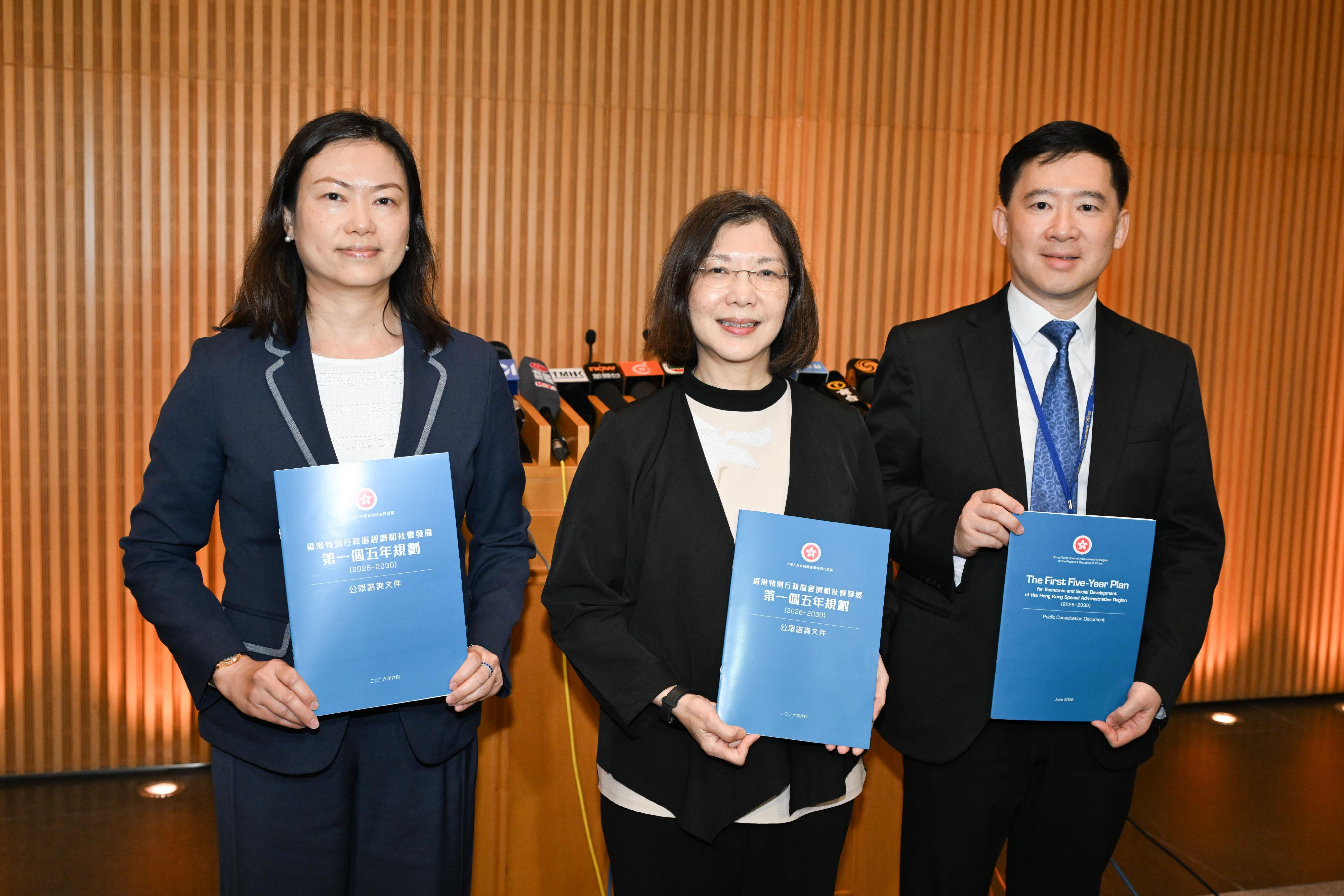 The Government of the Hong Kong Special Administrative Region today (June 15) launched the public consultation on The First Five-Year Plan for Economic and Social Development of the Hong Kong Special Administrative Region (2026-2030). Photo shows the Secretary for Constitutional and Mainland Affairs, Miss Janice Tse Siu-wa (centre); the Permanent Secretary for Constitutional and Mainland Affairs, Ms Maggie Wong (left); and the Under Secretary for Constitutional and Mainland Affairs, Mr Clement Woo (right), showing the public consultation document.
