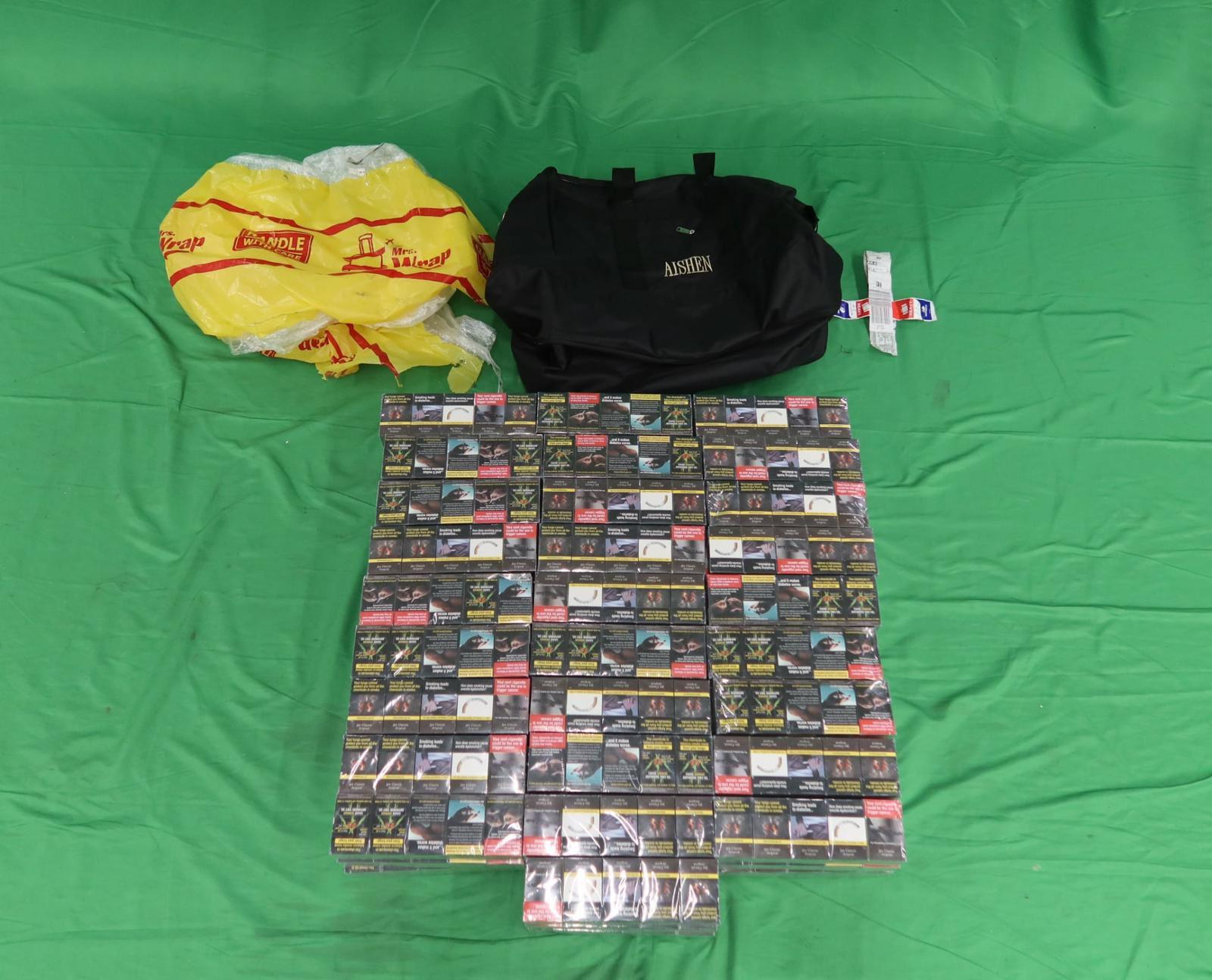 Five incoming passengers were sentenced to six weeks' to four months' imprisonment and fined $1,000 respectively by the Magistrates' Courts today (June 15) for possessing or importing duty-not-paid cigarettes and failing to declare to Customs Officers, in contravention of the Dutiable Commodities Ordinance, as well as for importing alternative smoking products, in contravention of the Dutiable Commodities Ordinance and the Import and Export Ordinance. Photo shows the duty-not-paid cigarettes seized from the personal baggage of an incoming 37-year-old Chinese male passenger.