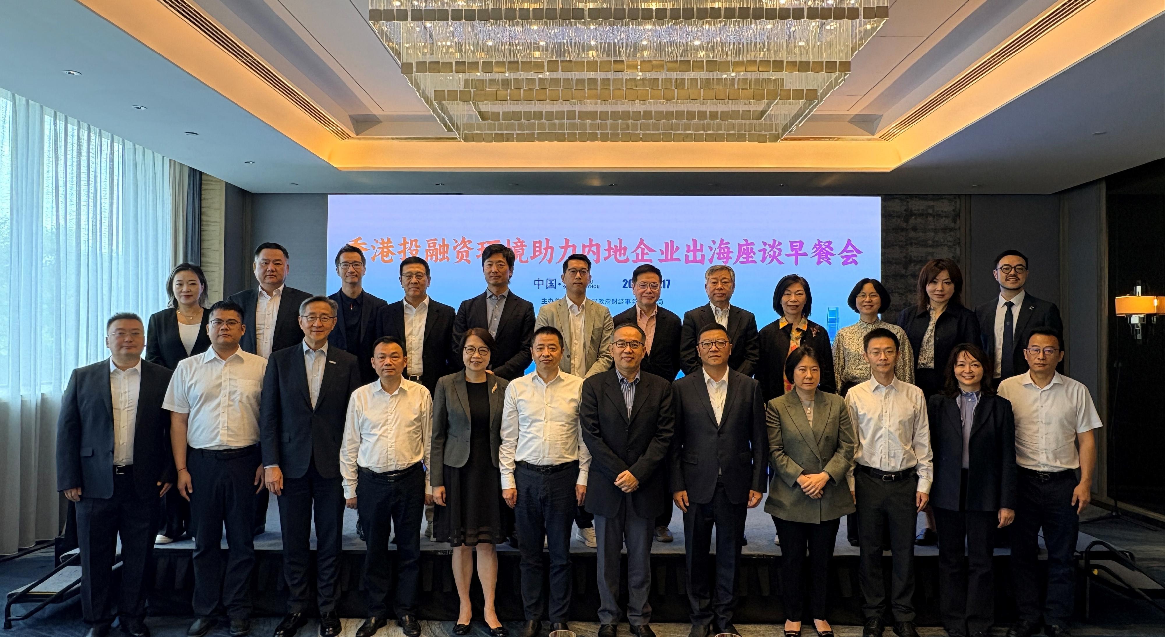 The Secretary for Financial Services and the Treasury, Mr Christopher Hui, and the financial delegation continued their visit to Suzhou today (June 17) and had a breakfast networking meeting with Zhongyifeng Holding Group Co Limited. Photo shows Mr Hui (front row, sixth right) with the company's Chairman of the Group Board, Mr Gong Changyi (front row, sixth left), and Director of Zhongyifeng Holding Group Co Limited, Mr Mo Lyuqun (front row, fifth right), as well as the Permanent Secretary for Financial Services and the Treasury (Financial Services), Mrs Angelina Cheung (front row, fifth left); the Director-General of Investment Promotion of Invest Hong Kong, Ms Alpha Lau (front row, fourth right); the Director-General of the Office for Attracting Strategic Enterprises, Mr Peter Yan (front row, third left); the Director of the Hong Kong Economic and Trade Office in Shanghai, Ms Veronica Wong (front row, second right), other members of the delegation, and company representatives.