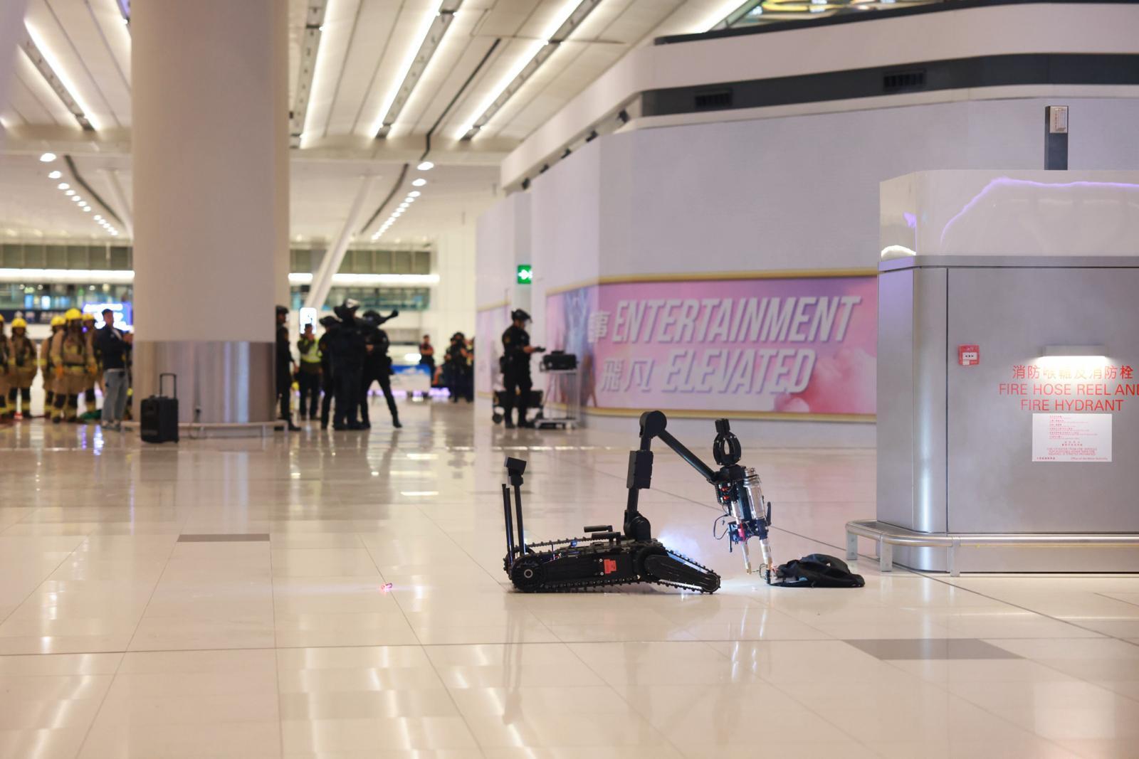 The Hong Kong Police Force (HKPF), in collaboration with various government departments and relevant organisations, successfully conducted a large-scale inter-departmental counter-terrorism, major incident and protective security exercise codenamed “SECUREWALL” at Hong Kong International Airport and Tung Chung from last night (June 16) to the early hours today (June 17). Photo shows the officers of the Police Explosive Ordnance Disposal Bureau handling a suspected explosive device with a robot.
