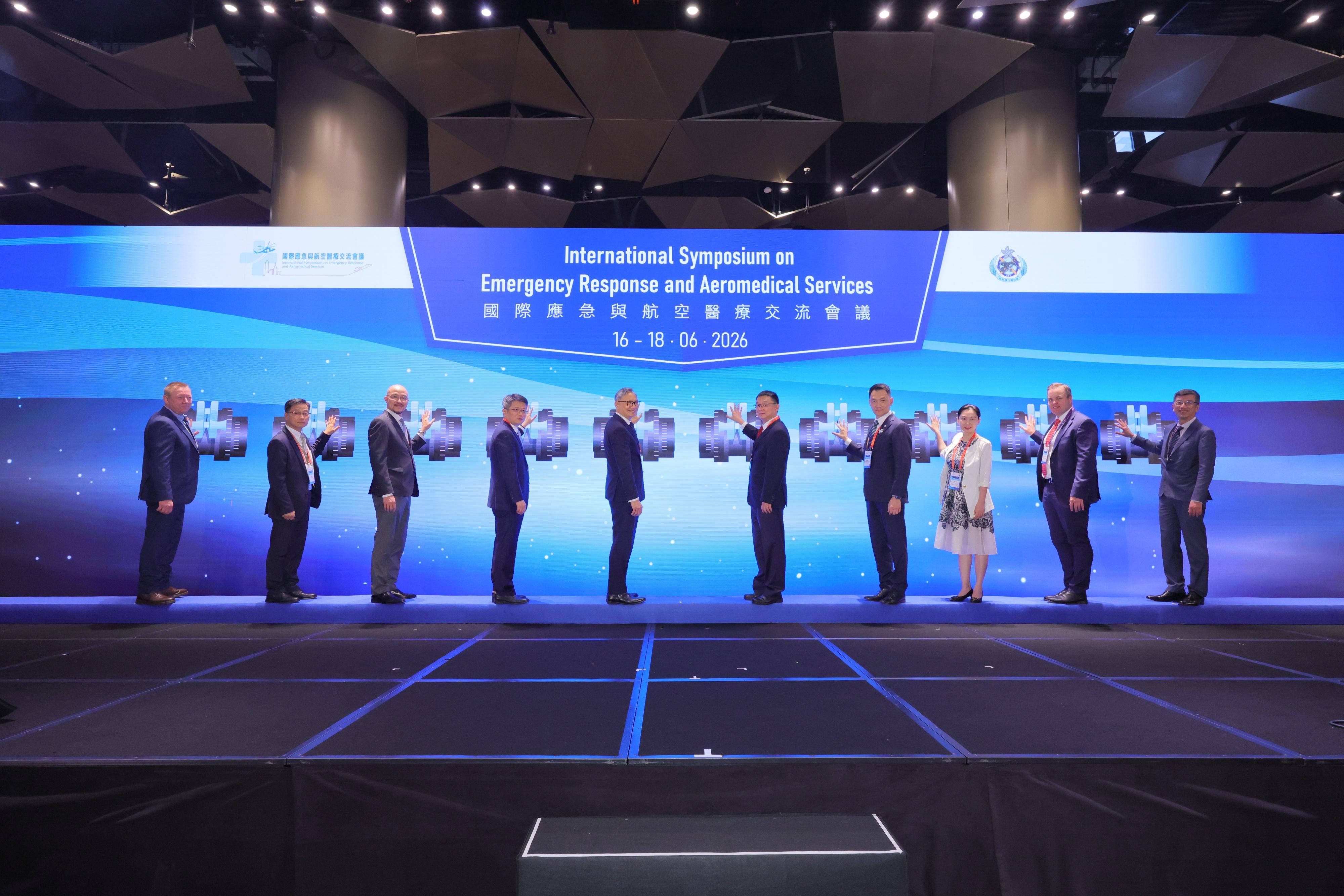 The Government Flying Service (GFS) holds the International Symposium on Emergency Response and Aeromedical Services from June 16 to 18. Photo shows the Under Secretary for Security, Mr Michael Cheuk (fifth left); the Director General of the Rescue and Salvage Bureau of the Ministry of Transport of the People's Republic of China, Mr Wang Lei (fifth right); the Controller of GFS, Mr Eddie Liu (fourth right), and other guests officiating at the opening ceremony today (June 17).