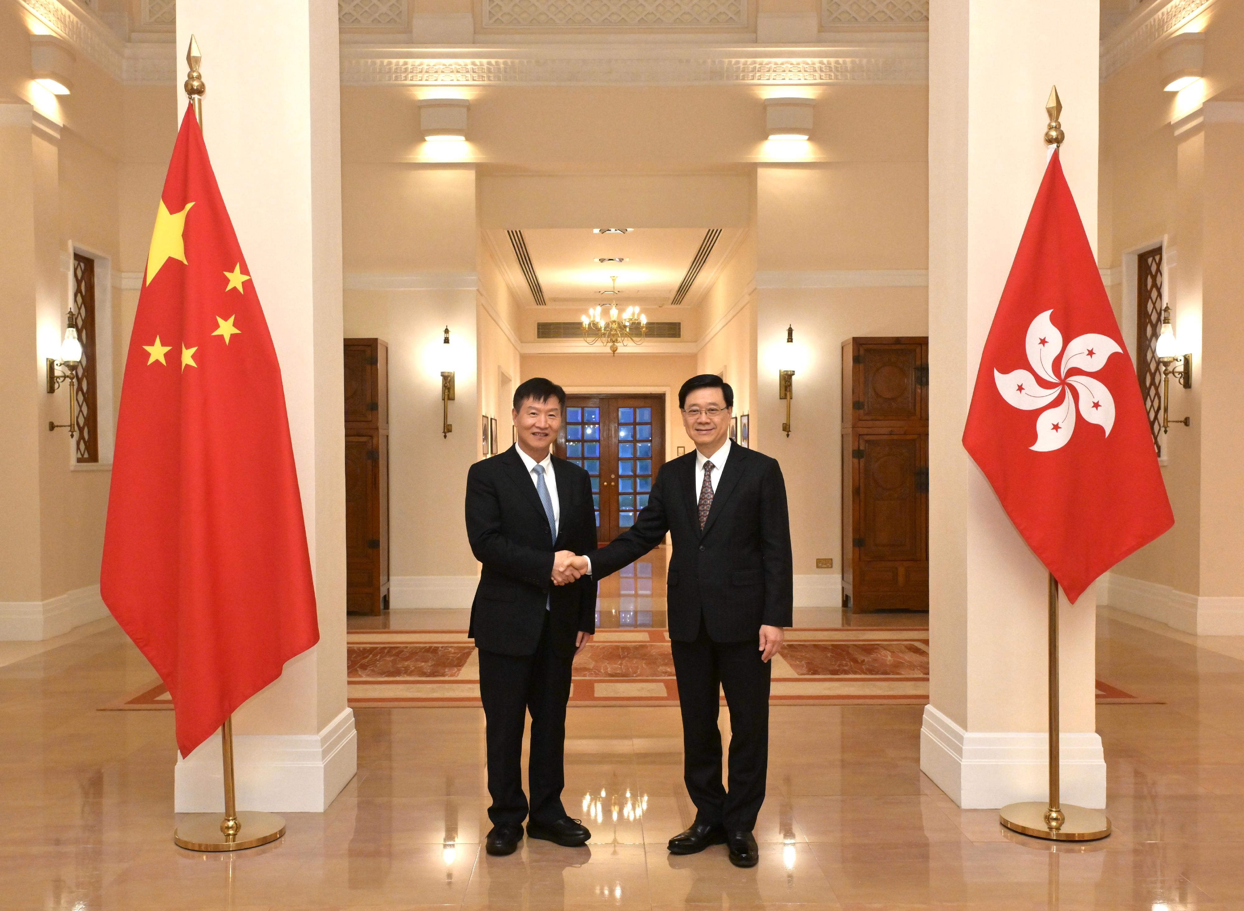 The Chief Executive, Mr John Lee (right), meets with the Governor of Hainan Province, Mr Liu Xiaoming (left), at Government House today (June 17).