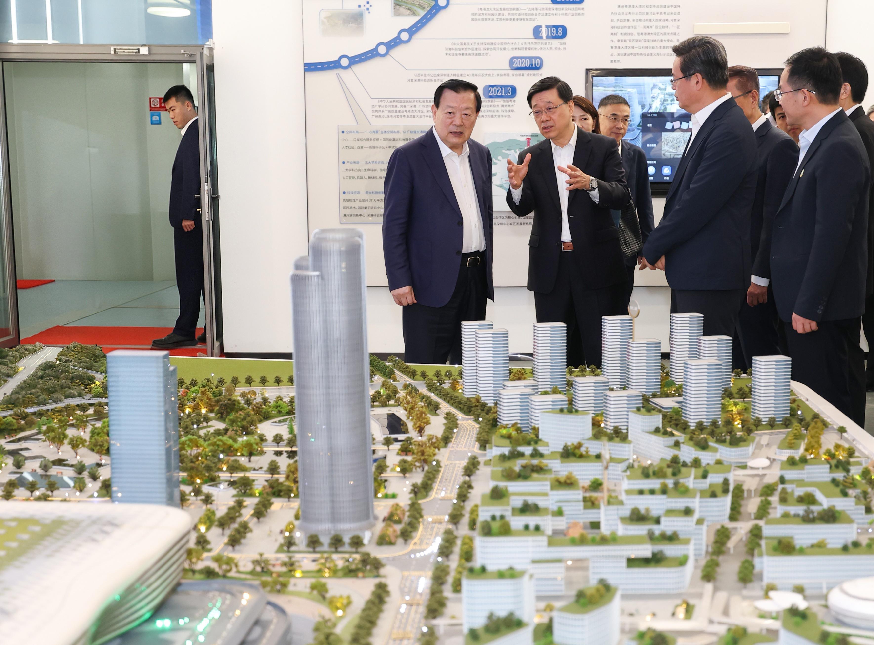 The Director of the Hong Kong and Macao Work Office of the Communist Party of China Central Committee and the Hong Kong and Macao Affairs Office of the State Council, Mr Xia Baolong (second left), today (June 17) visits the new Huanggang Port in the company of the Chief Executive, Mr John Lee (third left).