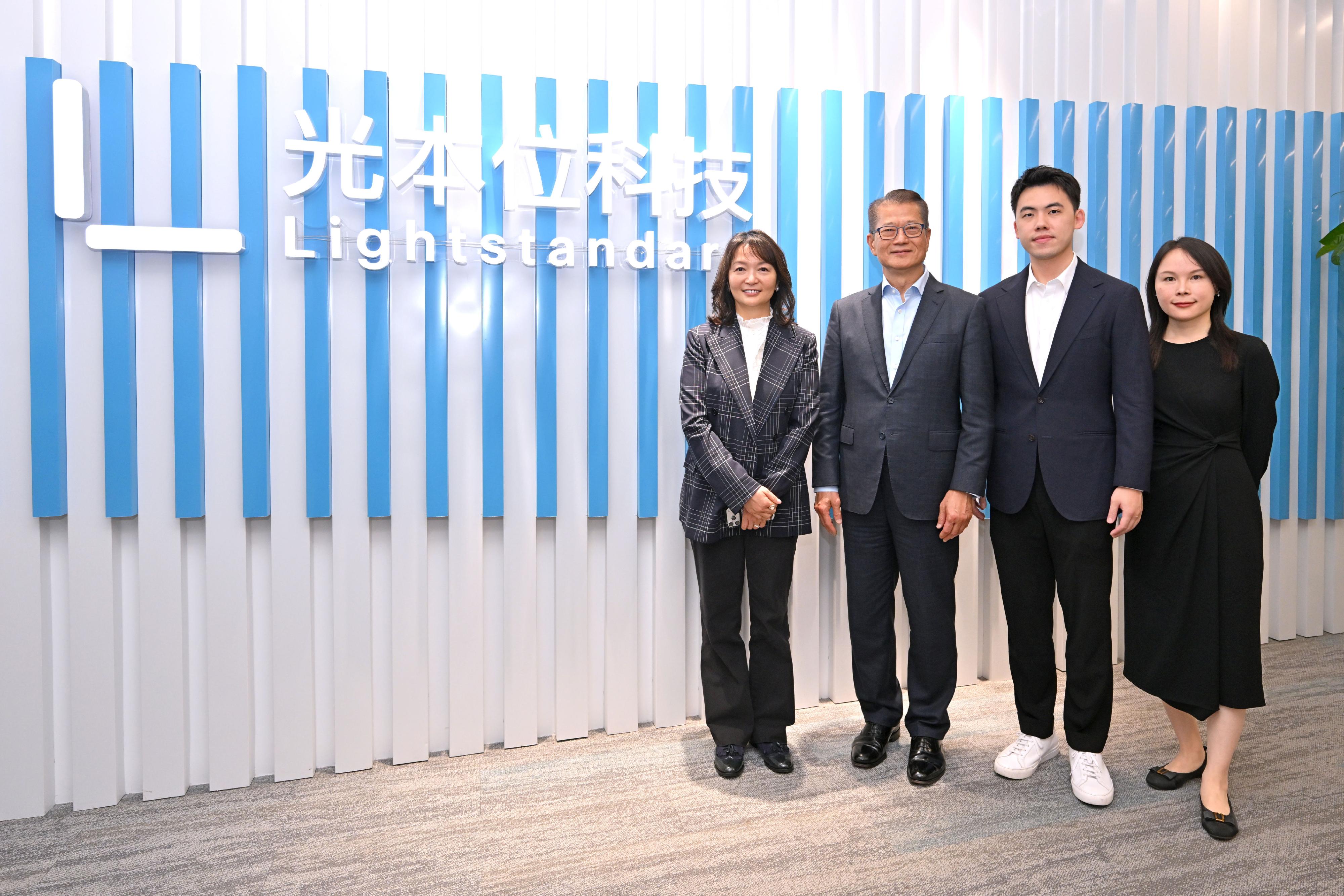 The Financial Secretary, Mr Paul Chan, continued his visit to Shanghai today (June 18). Photo shows Mr Chan (second left), the Director of the Hong Kong Economic and Trade Office in Shanghai of the Government of the Hong Kong Special Administrative Region, Ms Veronica Wong (first left); Director of Lightstandard Company Limited Mr Xiong Yinjiang (second right), and a person-in-charge of Lightstandard Company Limited during his visit to the company.
