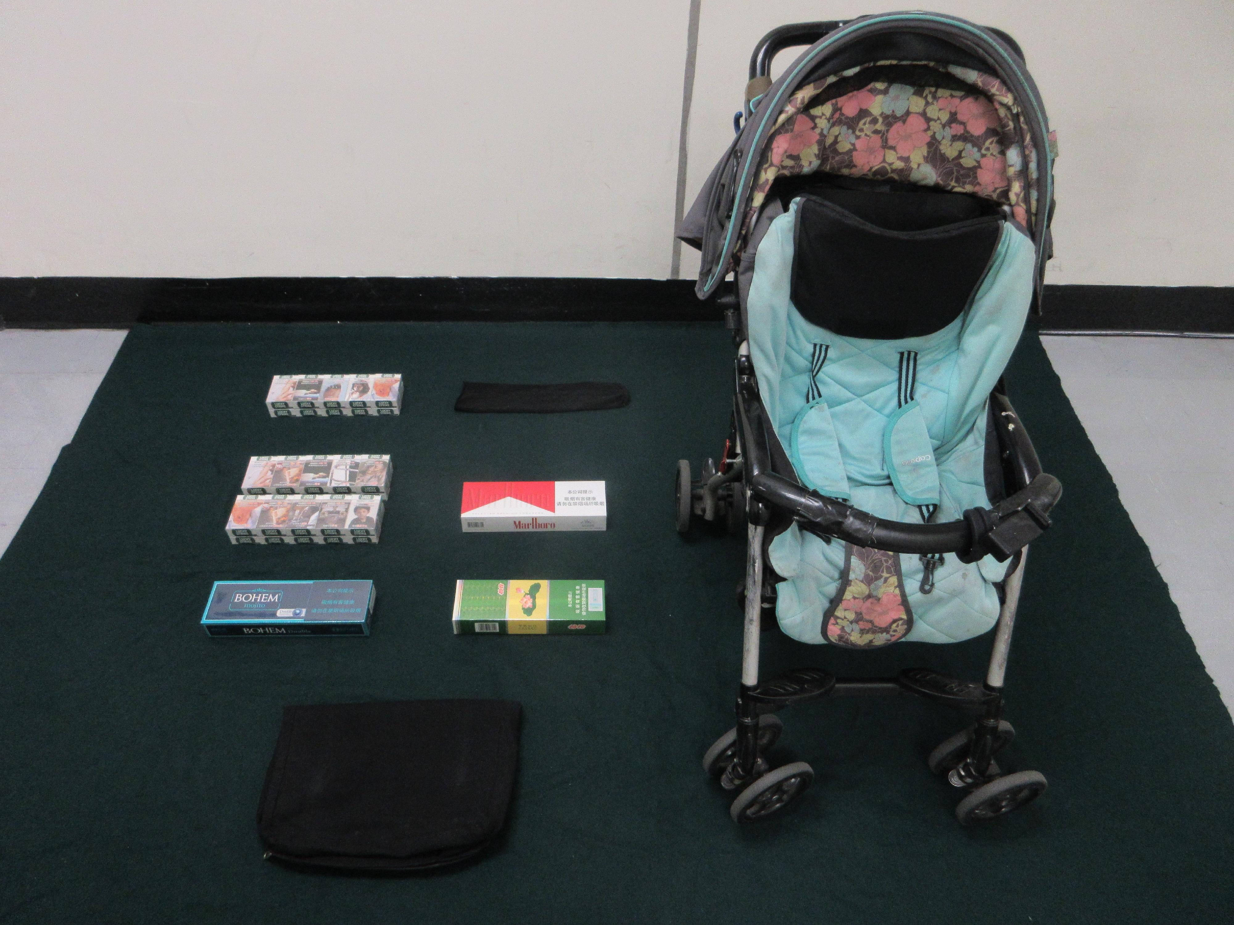 Two incoming passengers were each sentenced to two months' imprisonment by the Fanling Magistrates' Courts today (June 18) for importing duty-not-paid cigarettes and failing to declare them to Customs officers, in contravention of the Dutiable Commodities Ordinance. Photo shows the duty-not-paid cigarettes seized from the baby stroller carried by the passengers.