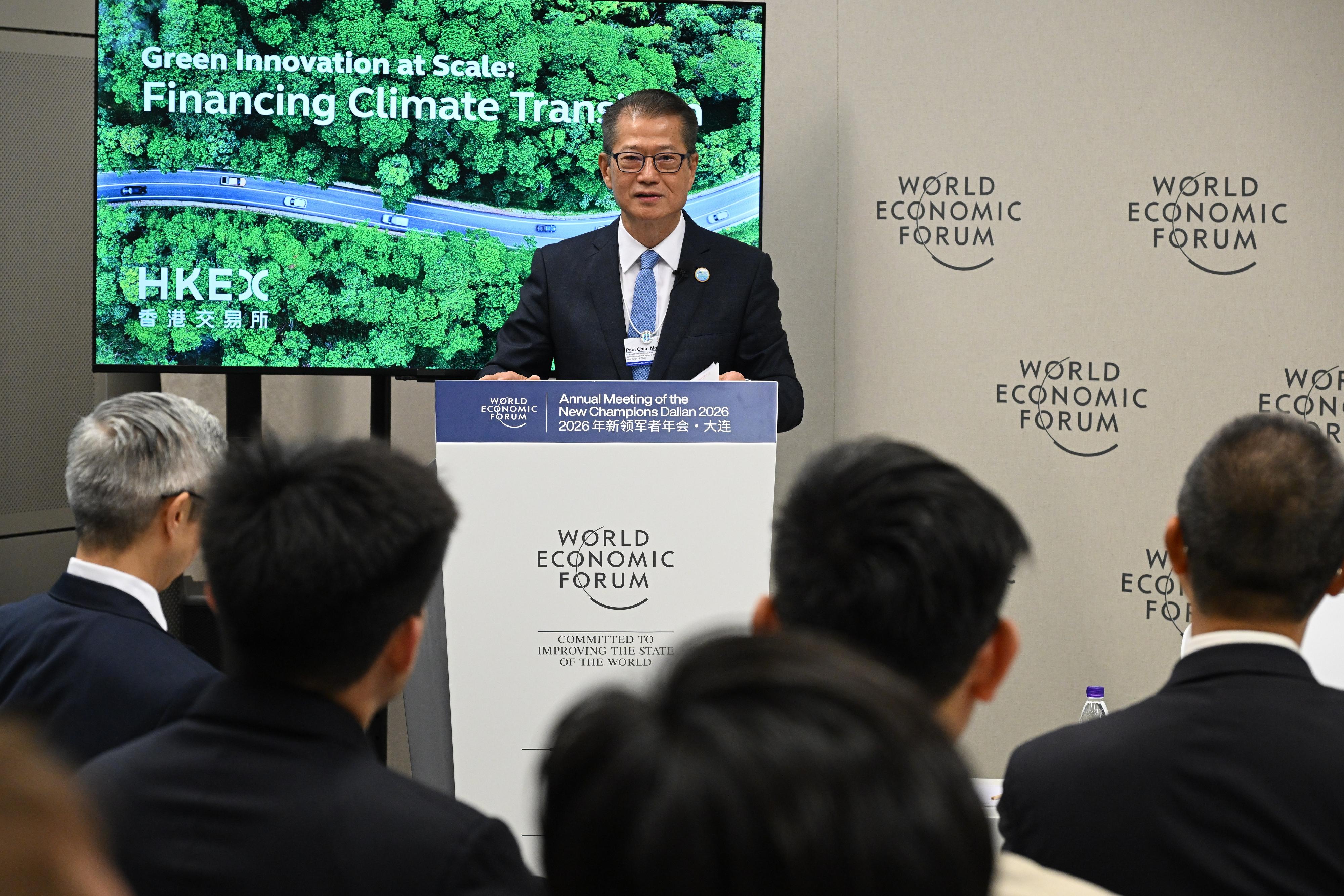 The Financial Secretary, Mr Paul Chan, continued to attend the World Economic Forum's Annual Meeting of the New Champions 2026 in Dalian this morning (June 25). Photo shows Mr Chan delivering a keynote speech at an accredited session held by the Hong Kong Stock Exchange themed "Scaling Green Technology for Climate Impact: How Capital Markets Accelerate Change".
