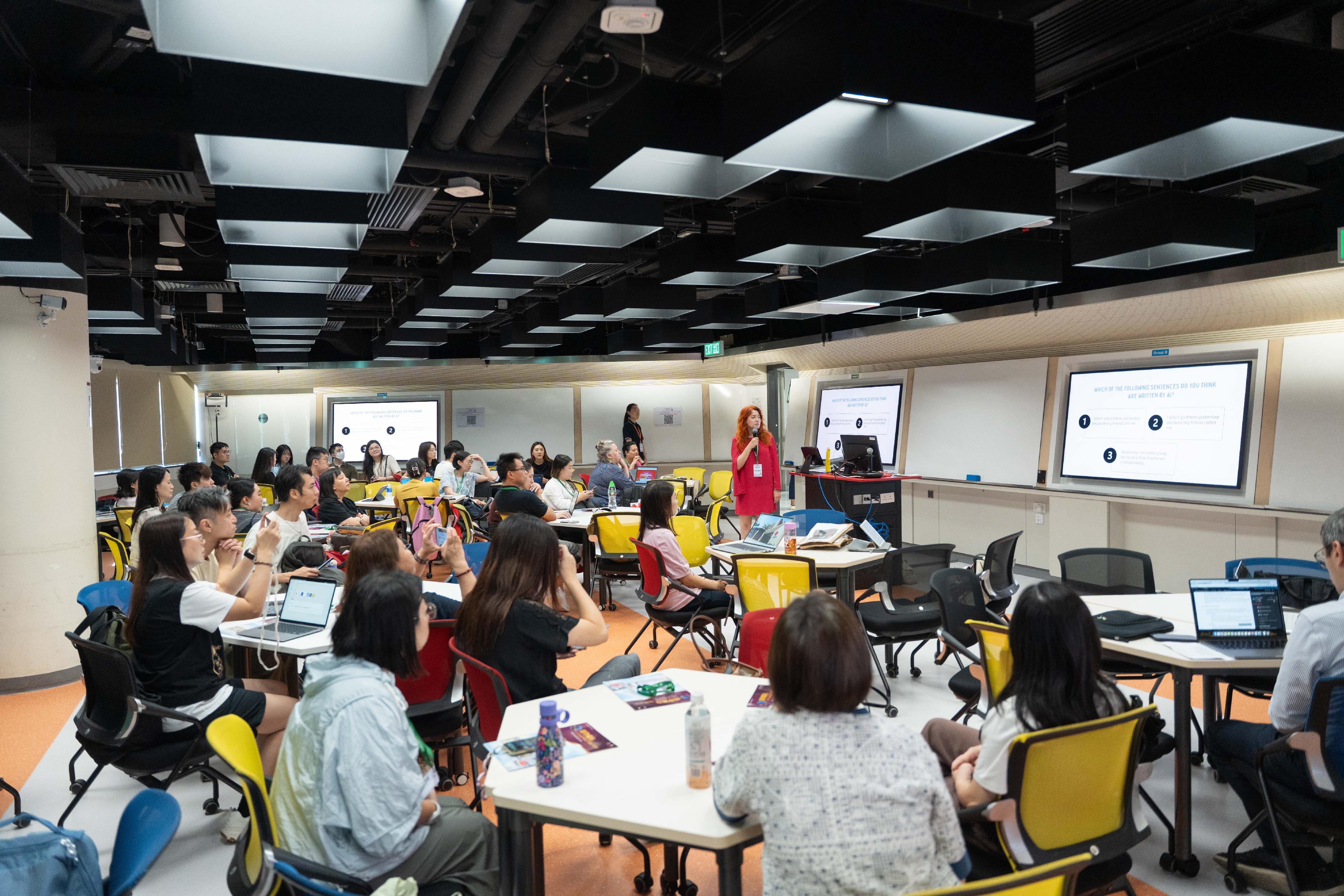 The second Digital Education Week, held for seven consecutive days from June 21, has concluded today (June 27). Photo shows participants engaging in a workshop to learn about the application of AI-powered teaching tools at the International Summit on the Use of AI in Language Learning and Teaching 2026.