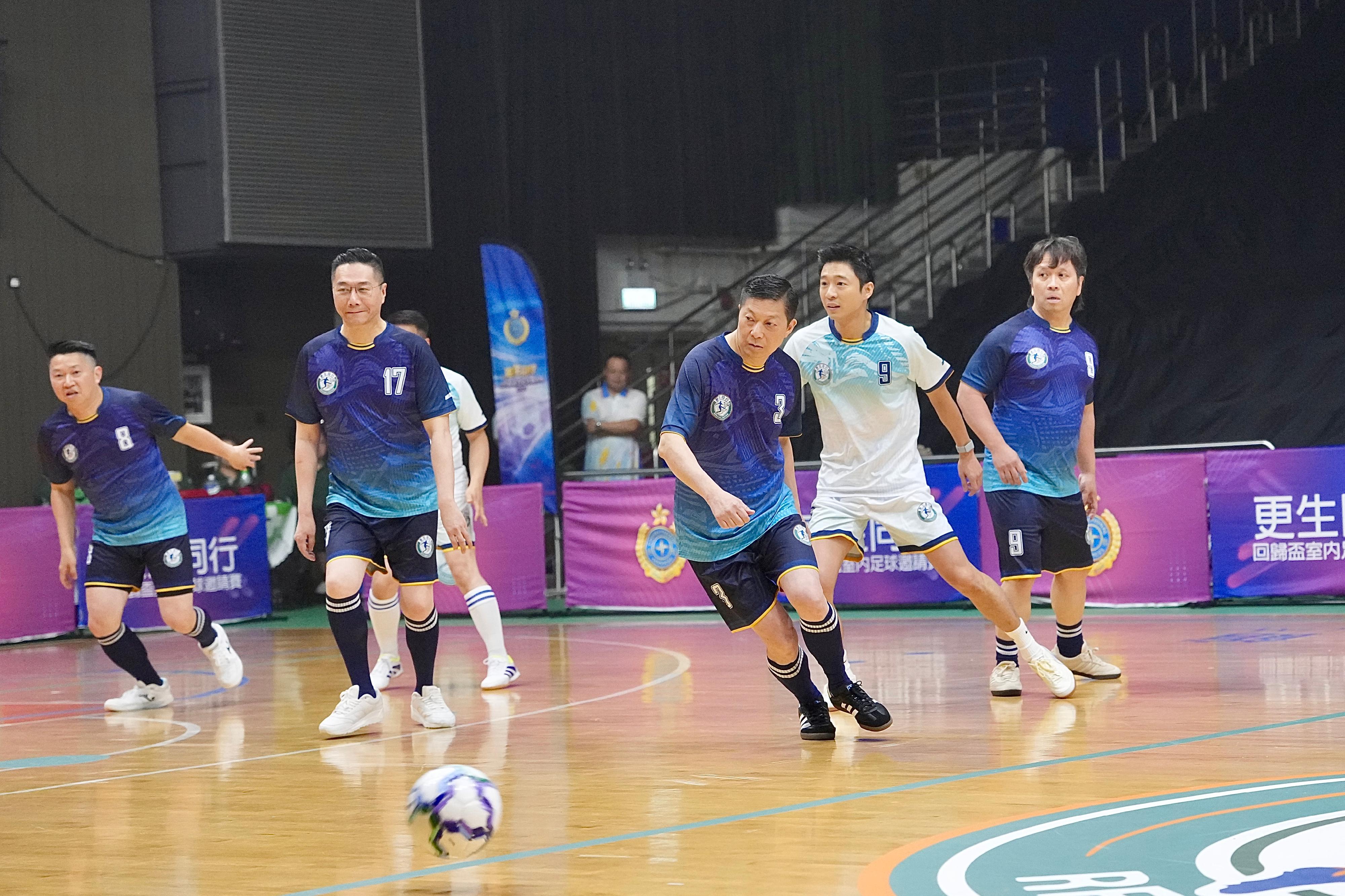 The Correctional Services Department today (June 28) held the Joining Hands on the Road to Rehabilitation &ndash; Hong Kong Reunification Futsal Tournament at Southorn Stadium in Wan Chai. The event attracted more than 600 guests, organisations and individuals from various sectors supporting rehabilitation, members of youth uniformed groups and rehabilitated persons. Through the sport of football, the event aimed to promote the message of "Joining Hands on the Road to Rehabilitation" and to celebrate the 29th anniversary of the return of the Hong Kong Special Administrative Region to the motherland. Photo shows the Secretary for Security, Mr Tang Ping-keung (third right), and the Chairman of the Football Association of Hong Kong, China, Mr Eric Fok (second right), participating in the exhibition match with stakeholders from different sectors.