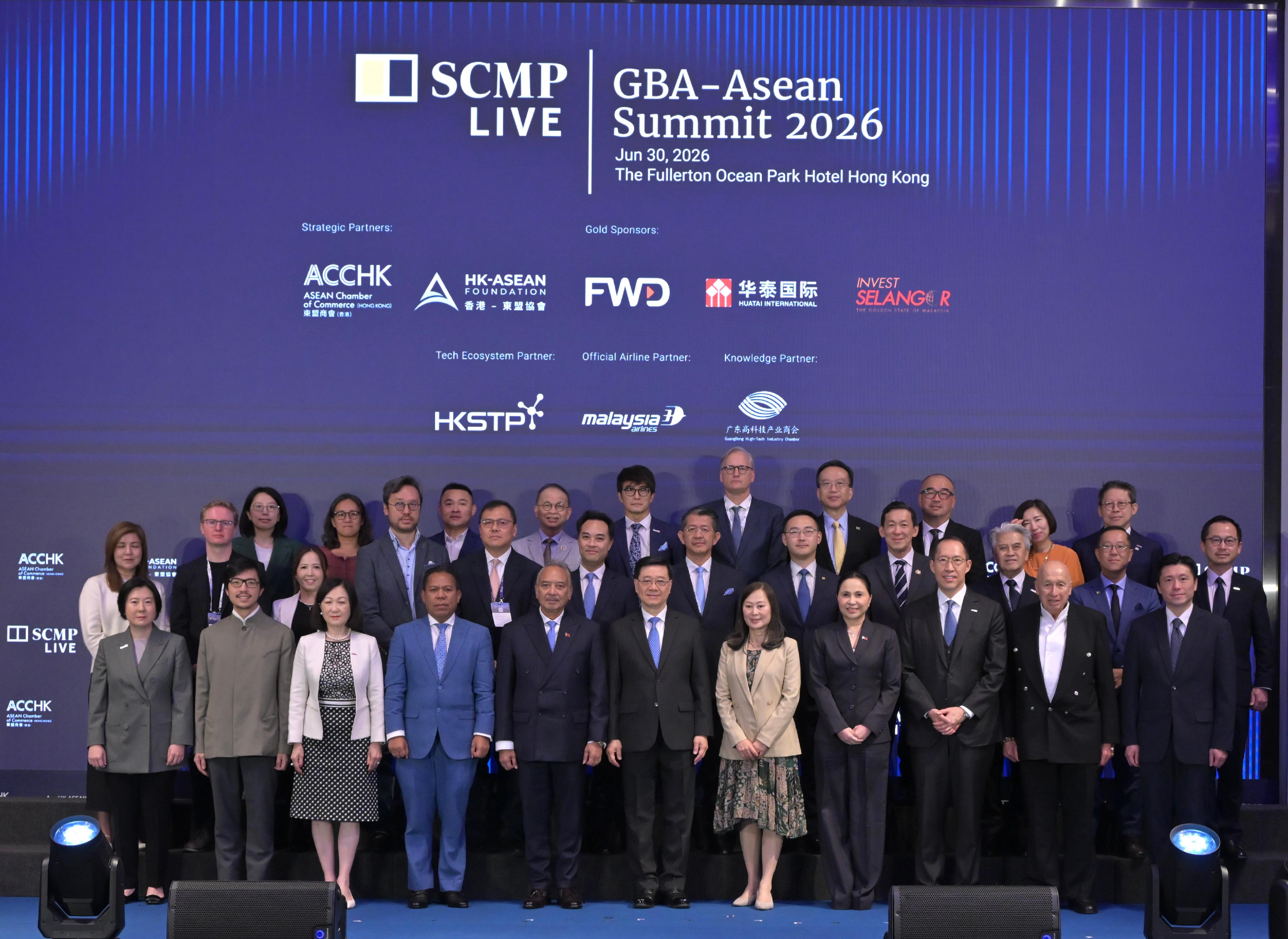 The Chief Executive, Mr John Lee, attended the South China Morning Post GBA-ASEAN Summit 2026 today (June 30). Photo shows Mr Lee (front row, centre); Deputy Prime Minister, Coordinating Minister for Economic Affairs and Minister for Tourism and Environment of Timor-Leste, Mr Francisco Kalbuadi Lay (front row, fifth left); the Secretary of the Department of Trade and Industry of the Philippines, Ms Maria Cristina Aldeguer-Roque (front row, fourth right); the Publisher of the South China Morning Post, Ms Tammy Tam (front row, fifth right); the Chairman of the Hong Kong-ASEAN Foundation, Dr Daryl Ng (front row, third right), and other guests at the event.