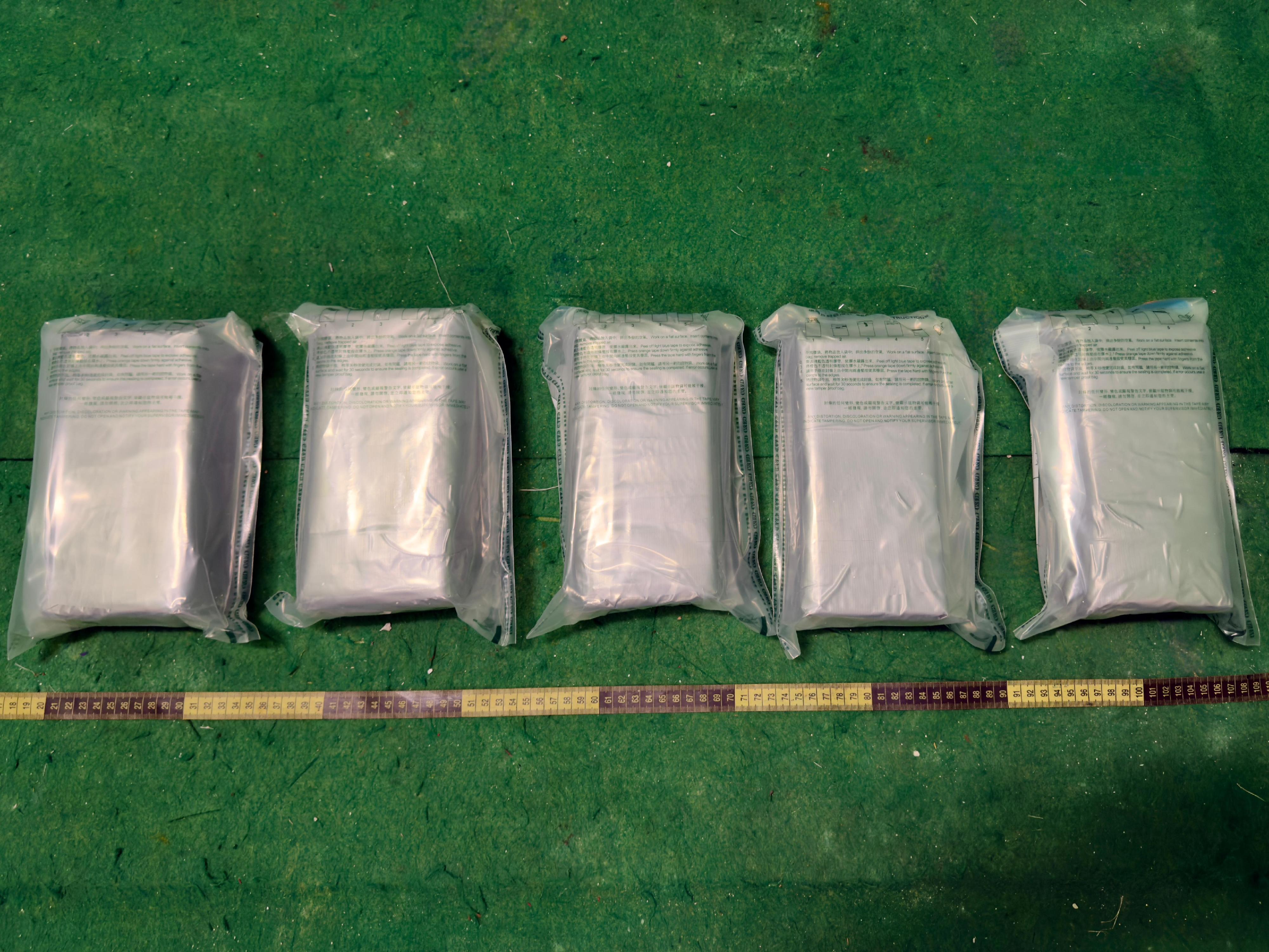 Hong Kong Customs yesterday (June 29) seized a total of about 5 kilograms of suspected cocaine, 3.5 grams of suspected methamphetamine, 0.3g of suspected heroin and small amount of drug-inhaling apparatus with a total estimated market value of around $4 million at Hong Kong International Airport, Tai Kok Tsui and Tung Chung. Photo shows the suspected cocaine seized.