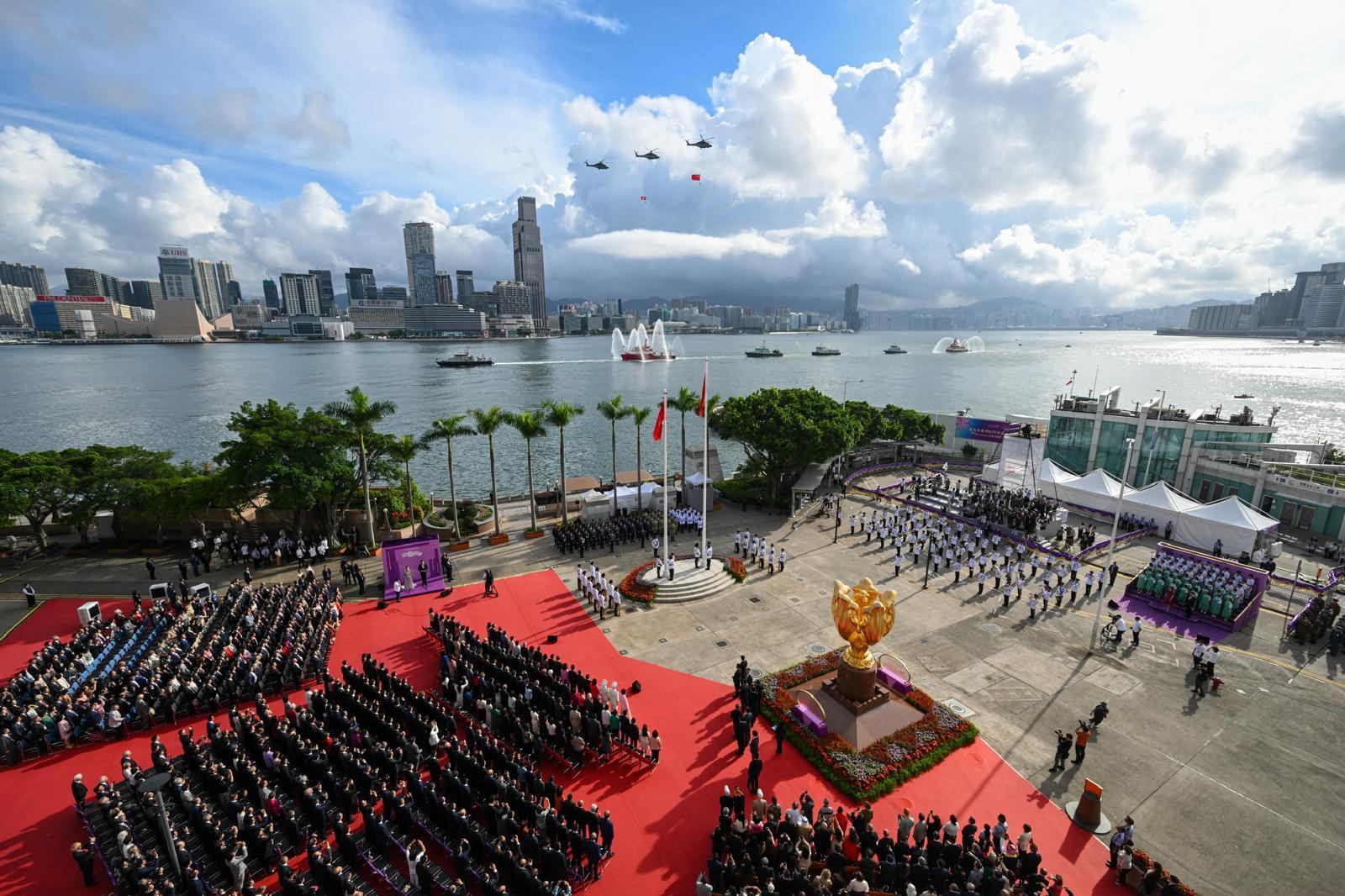 The disciplined services and the Government Flying Service perform a sea parade and a fly-past to mark the 29th anniversary of the establishment of the Hong Kong Special Administrative Region at the flag-raising ceremony at Golden Bauhinia Square in Wan Chai this morning (July 1).