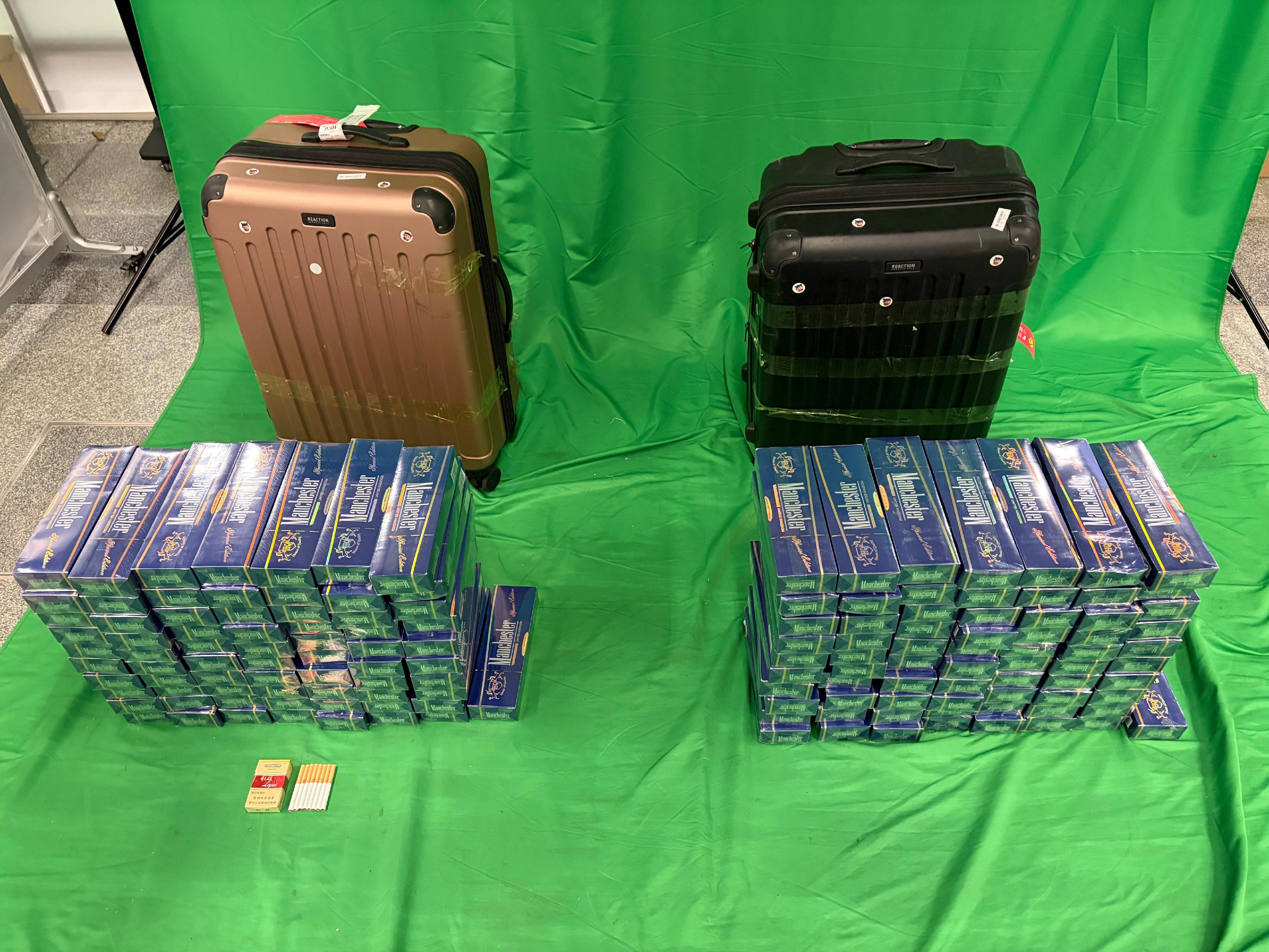 Three incoming passengers were sentenced to between three to six months' imprisonment and fined $500 each by the West Kowloon Magistrates' Courts today (July 2) for importing duty-not-paid cigarettes and failing to declare them to Customs officers, in contravention of the Dutiable Commodities Ordinance. Photo shows the duty-not-paid cigarettes seized from the personal baggage of a 41-year-old incoming male passenger.