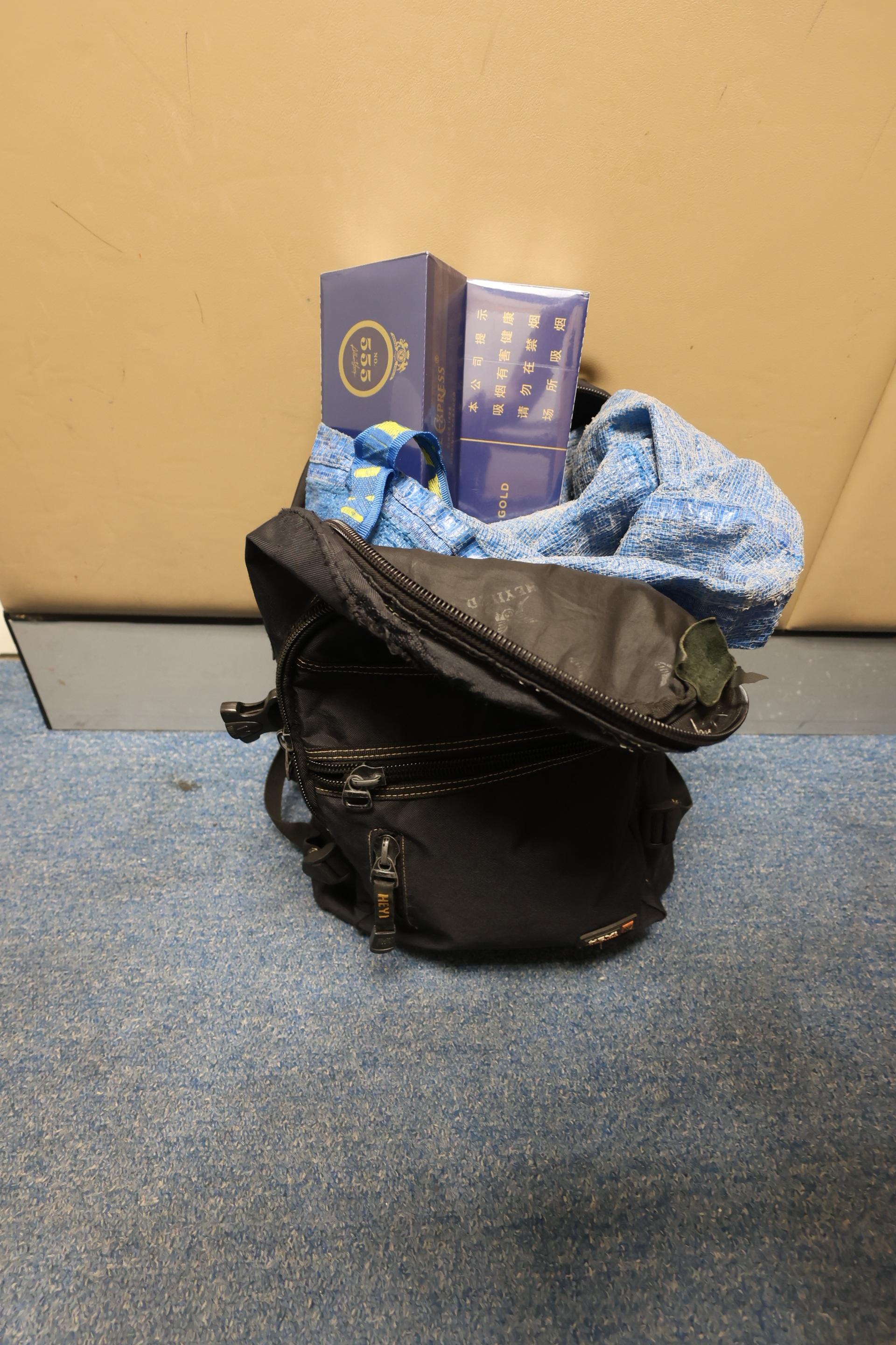 One incoming Mainland male passenger and two incoming local female passengers were sentenced to six weeks' imprisonment with a fine of $1,000 to ten months' imprisonment and a fine of $500 by the Courts today (July 6) for importing or possessing duty-not-paid cigarettes and failing to declare to Customs officers, in contravention of the Dutiable Commodities Ordinance. Photo shows the duty-not-paid cigarettes seized from the personal baggage of an incoming 80-year-old local female passenger.