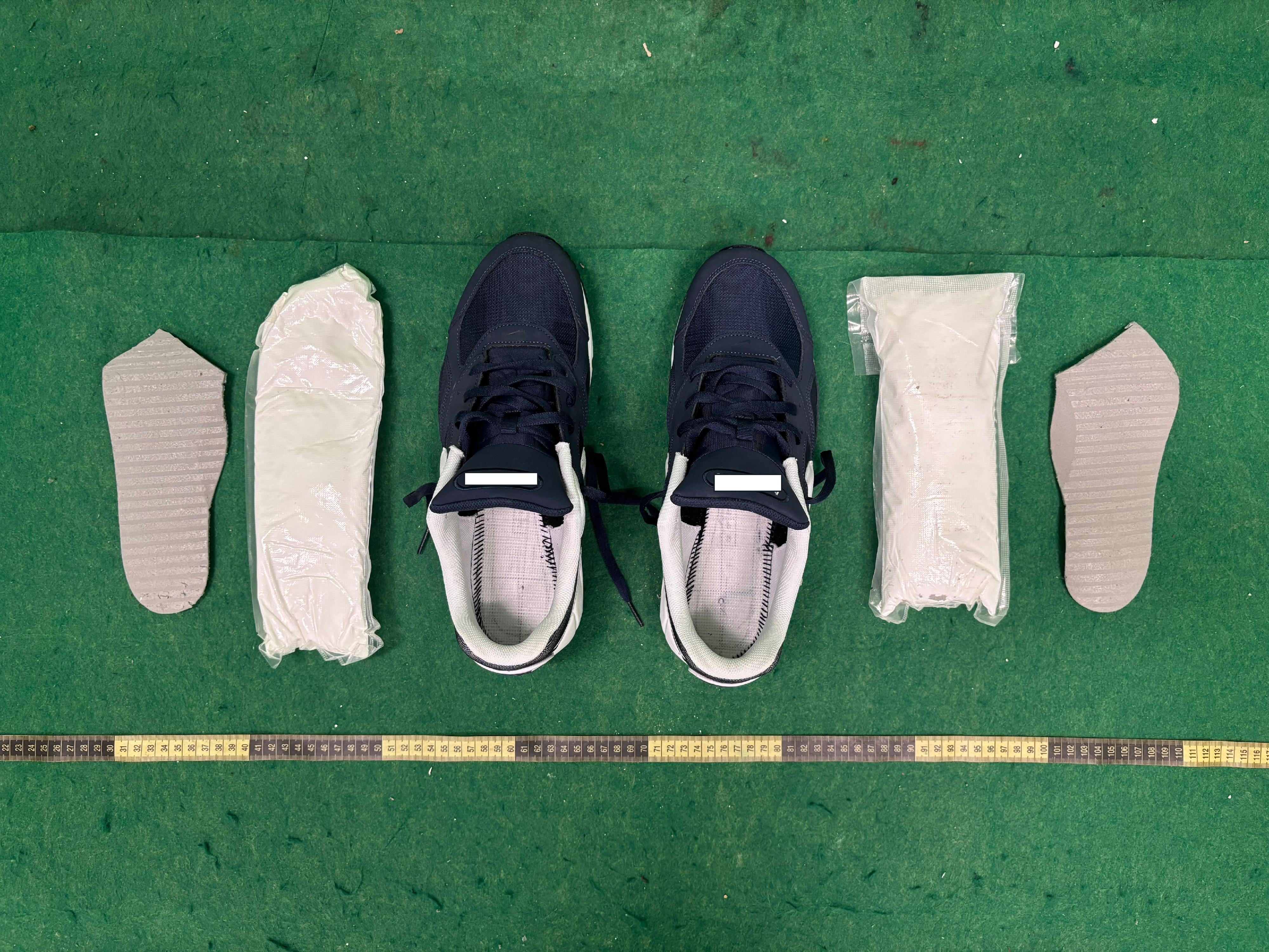 Hong Kong Customs today (July 7) detected one dangerous drug case and seized about 1 kilogram of suspected cocaine with an estimated market value of about $0.8 million at Hong Kong International Airport. Photo shows the suspected cocaine concealed in the shoes.