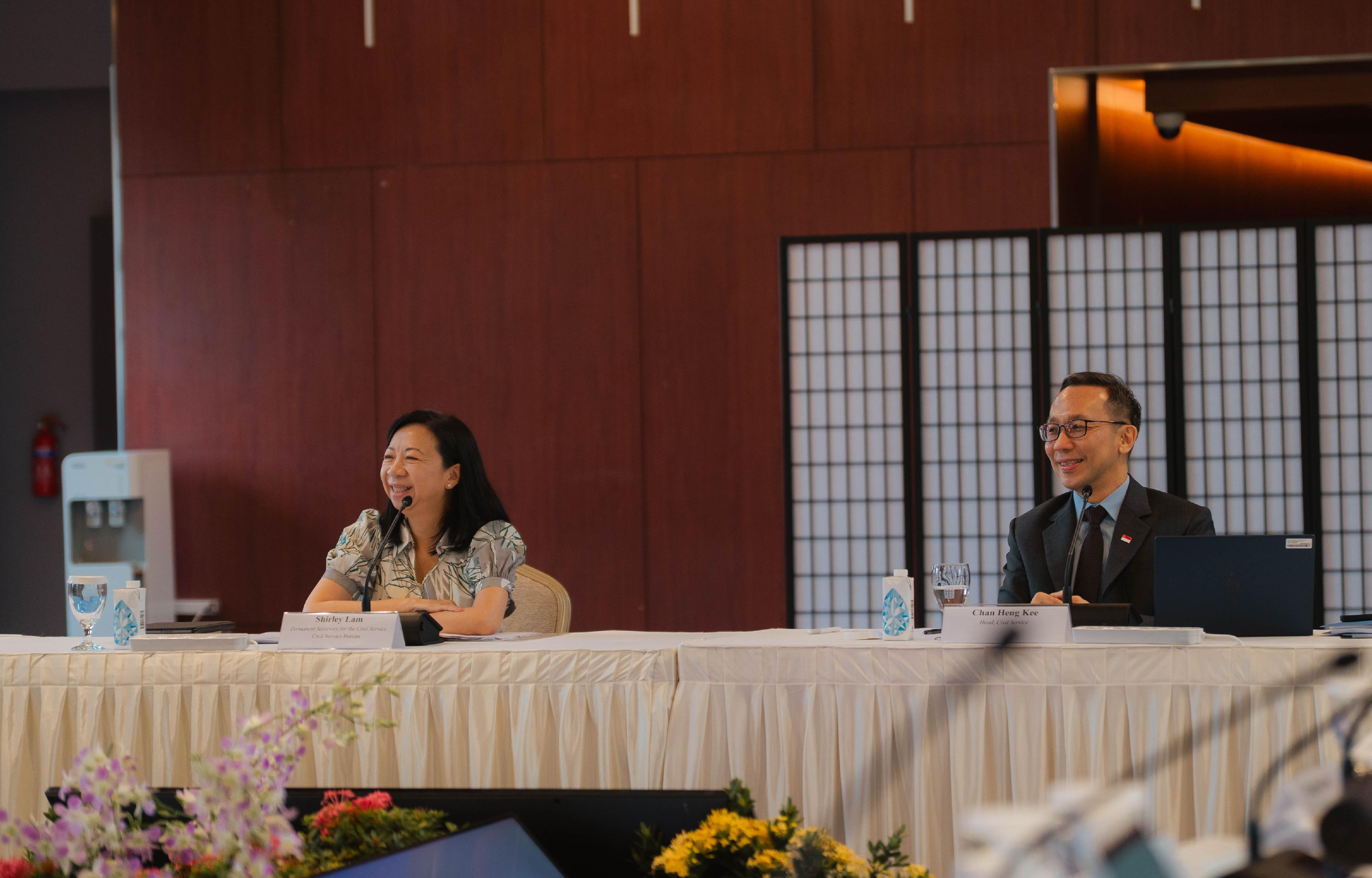 A delegation of seven Permanent Secretaries of the Hong Kong Special Administrative Region Government participated in the 8th Singapore-Hong Kong Permanent Secretaries Exchange Programme from July 6 to 8. The delegation had a roundtable discussion with a number of Permanent Secretaries of Singapore on three key topics, namely AI, citizen engagement and urban planning yesterday (July 7). Photo shows the Permanent Secretary for the Civil Service, Ms Shirley Lam (left), and the Head of Civil Service of Singapore, Mr Chan Heng Kee (right), at the meeting.