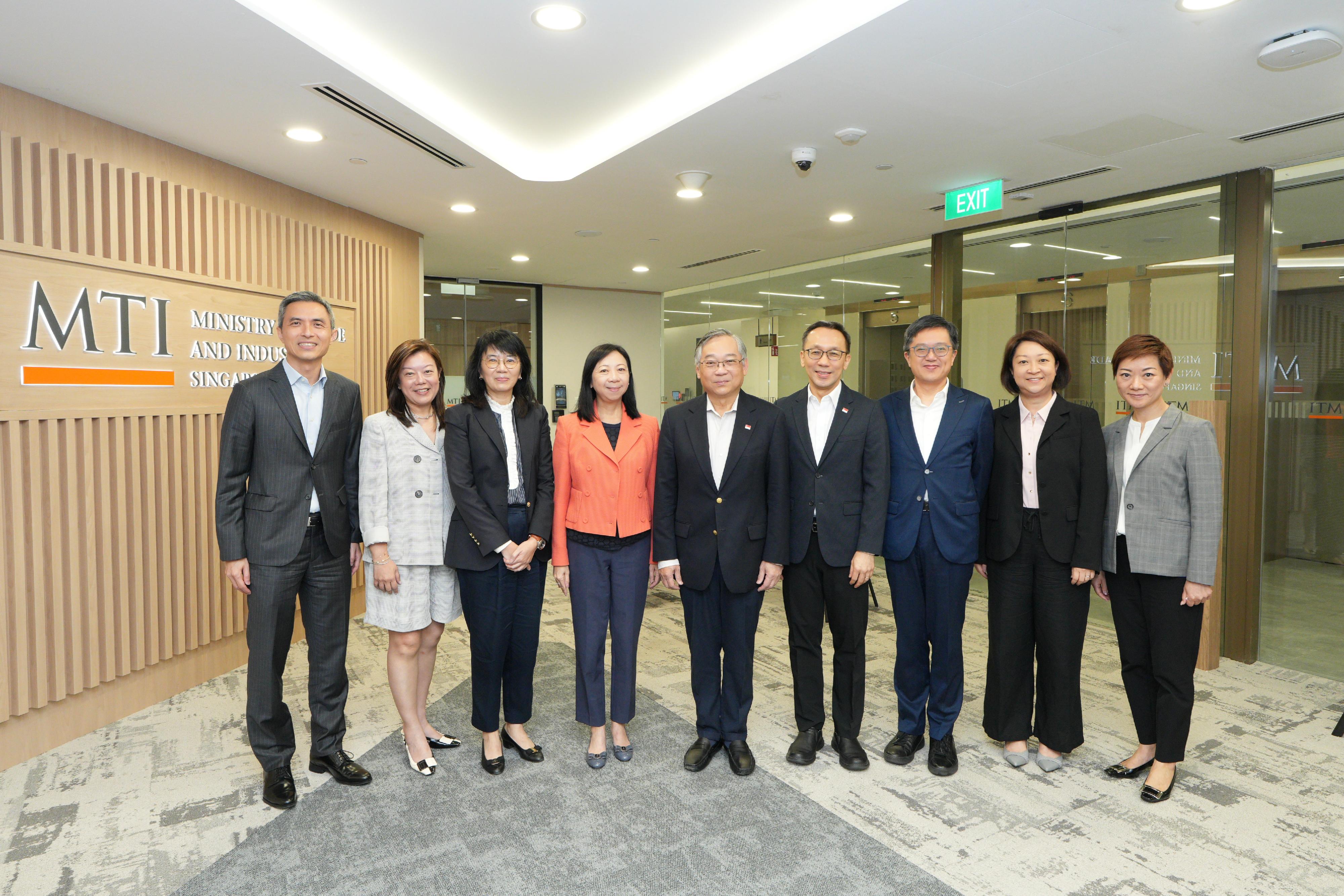 A delegation of seven Permanent Secretaries of the Hong Kong Special Administrative Region Government participated in the 8th Singapore-Hong Kong Permanent Secretaries Exchange Programme from July 6 to 8. Photo shows the Permanent Secretary for the Civil Service, Ms Shirley Lam (fourth left); the Permanent Secretary for Development (Planning and Lands), Ms Doris Ho (third left); the Permanent Secretary for Innovation, Technology and Industry, Mr Kevin Choi (third right); the Permanent Secretary for Education, Ms May Chan (second left); the Permanent Secretary for Commerce and Economic Development, Ms Angela Lee (second right); and the Permanent Secretary for Transport and Logistics, Mr Vic Yau (first left), with the Deputy Prime Minister and Minister for Trade and Industry of Singapore, Mr Gan Kim Yong (centre), and the Head of Civil Service of Singapore, Mr Chan Heng Kee (fourth right), after the meeting this morning (July 8). Looking on is the Director of the Hong Kong Economic and Trade Office in Singapore, Ms Elsa Hung (first right).