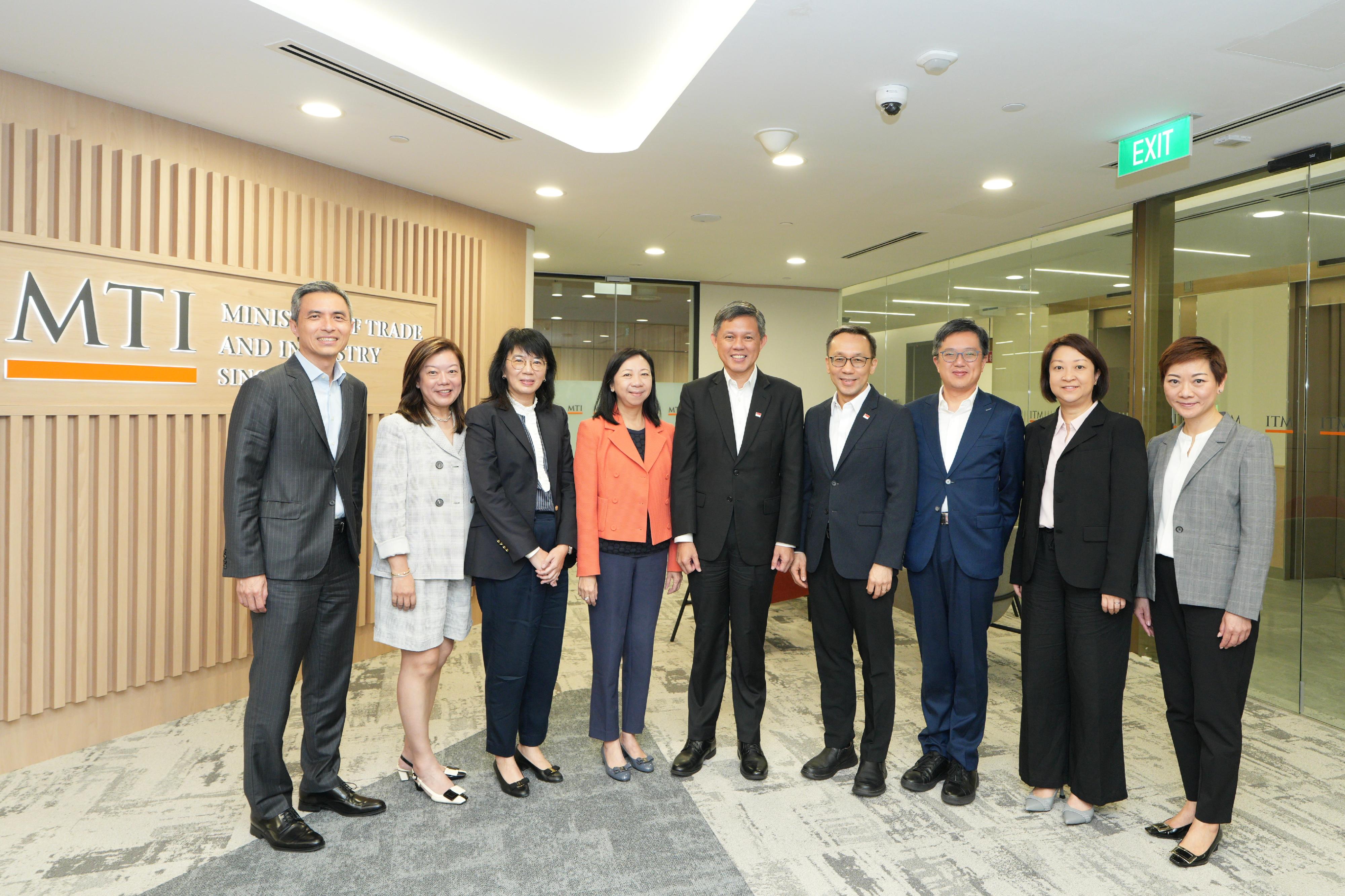 A delegation of seven Permanent Secretaries of the Hong Kong Special Administrative Region Government participated in the 8th Singapore-Hong Kong Permanent Secretaries Exchange Programme from July 6 to 8. Photo shows the Permanent Secretary for the Civil Service, Ms Shirley Lam (fourth left); the Permanent Secretary for Development (Planning and Lands), Ms Doris Ho (third left); the Permanent Secretary for Innovation, Technology and Industry, Mr Kevin Choi (third right); the Permanent Secretary for Education, Ms May Chan (second left); the Permanent Secretary for Commerce and Economic Development, Ms Angela Lee (second right); and the Permanent Secretary for Transport and Logistics, Mr Vic Yau (first left), with the Coordinating Minister for Public Services of Singapore, Mr Chan Chun Sing (centre), and the Head of Civil Service of Singapore, Mr Chan Heng Kee (fourth right), after the meeting this morning (July 8). Looking on is the Director of the Hong Kong Economic and Trade Office in Singapore, Ms Elsa Hung (first right).