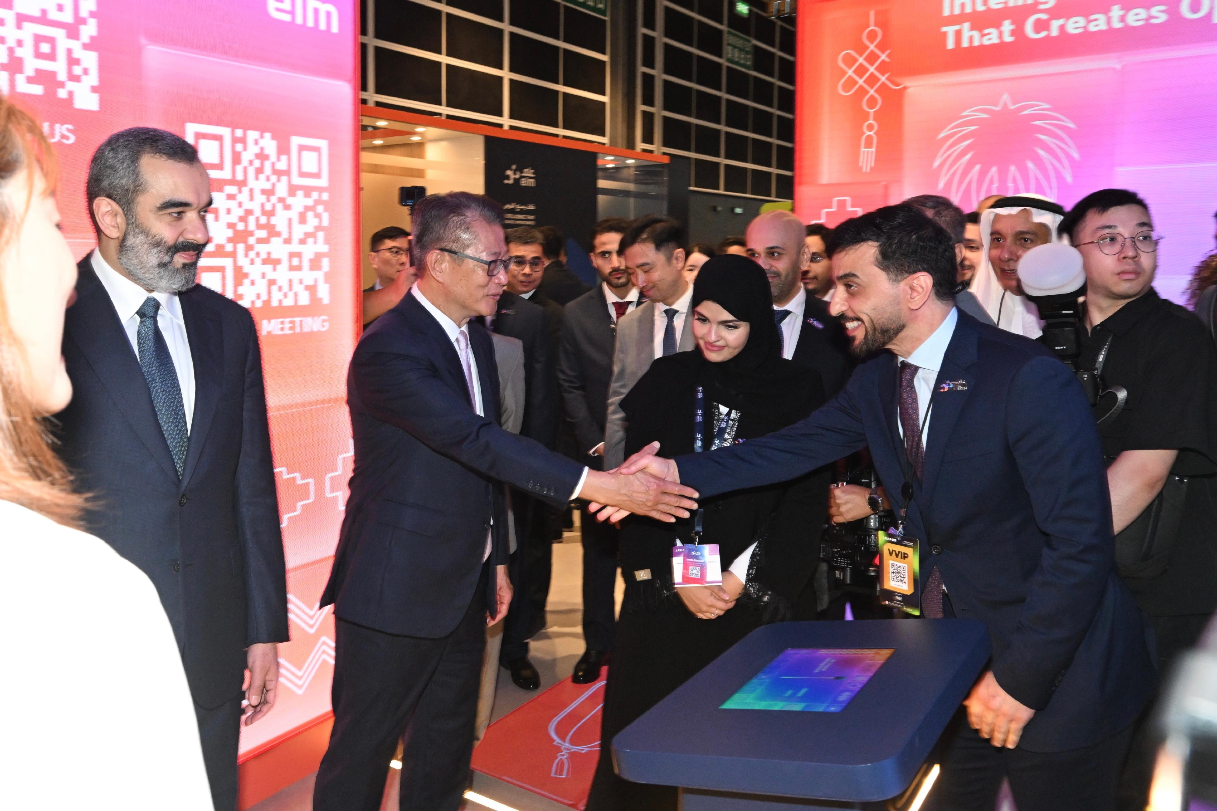 The Financial Secretary, Mr Paul Chan, attended the LEAP East 2026 opening ceremony today (July 8). Photos shows Mr Chan (second left) touring an exhibition booth.