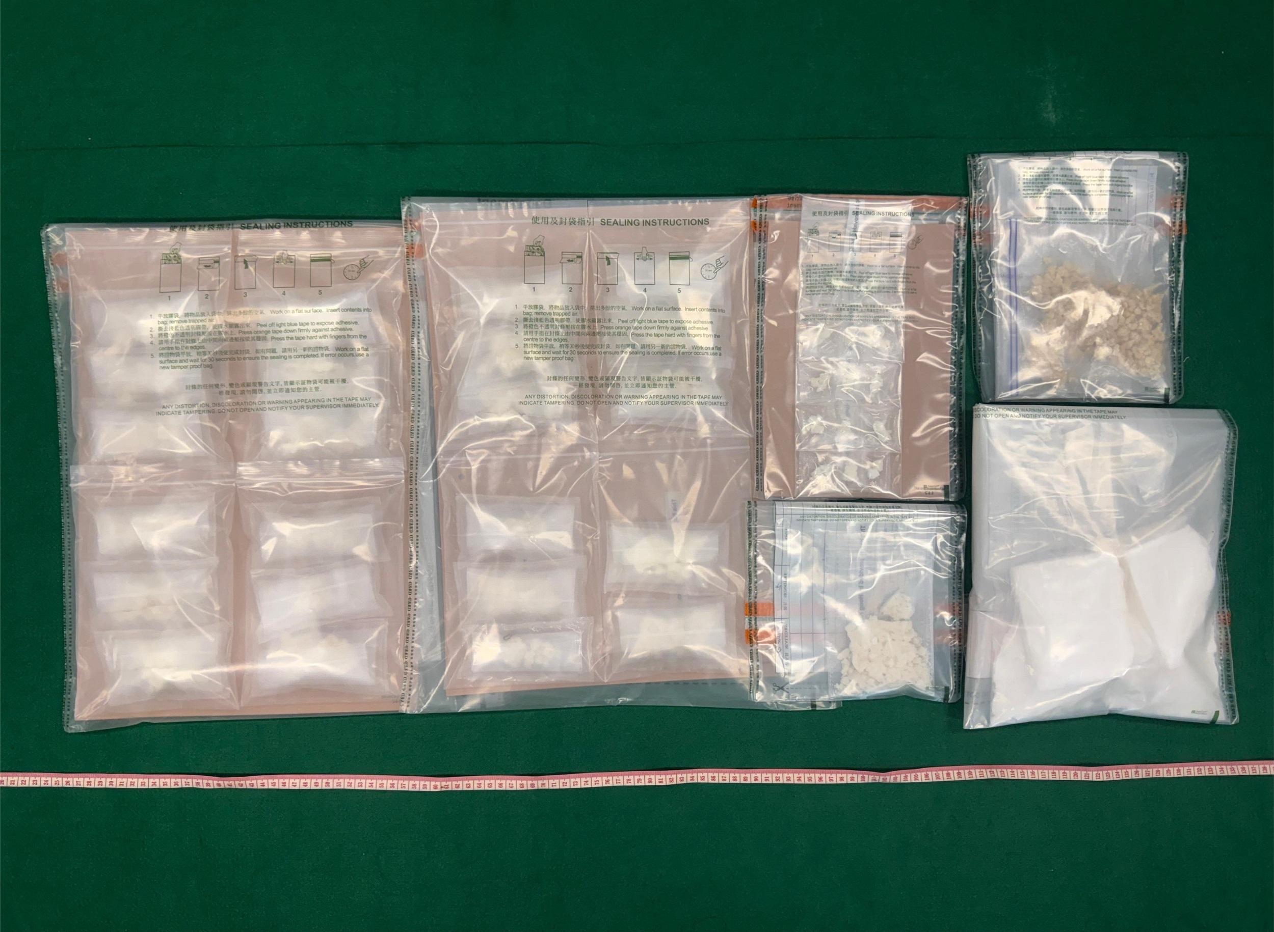 Hong Kong Customs detected two dangerous drugs cases in Kwai Chung and To Kwa Wan on July 3 and yesterday (July 8) and seized a total of about 56 kilograms of suspected ketamine, 1.2kg of suspected cocaine and 800 grams of suspected crack cocaine with a total estimated market value of about $23 million. Photo shows the suspected cocaine and suspected crack cocaine seized in the second case.