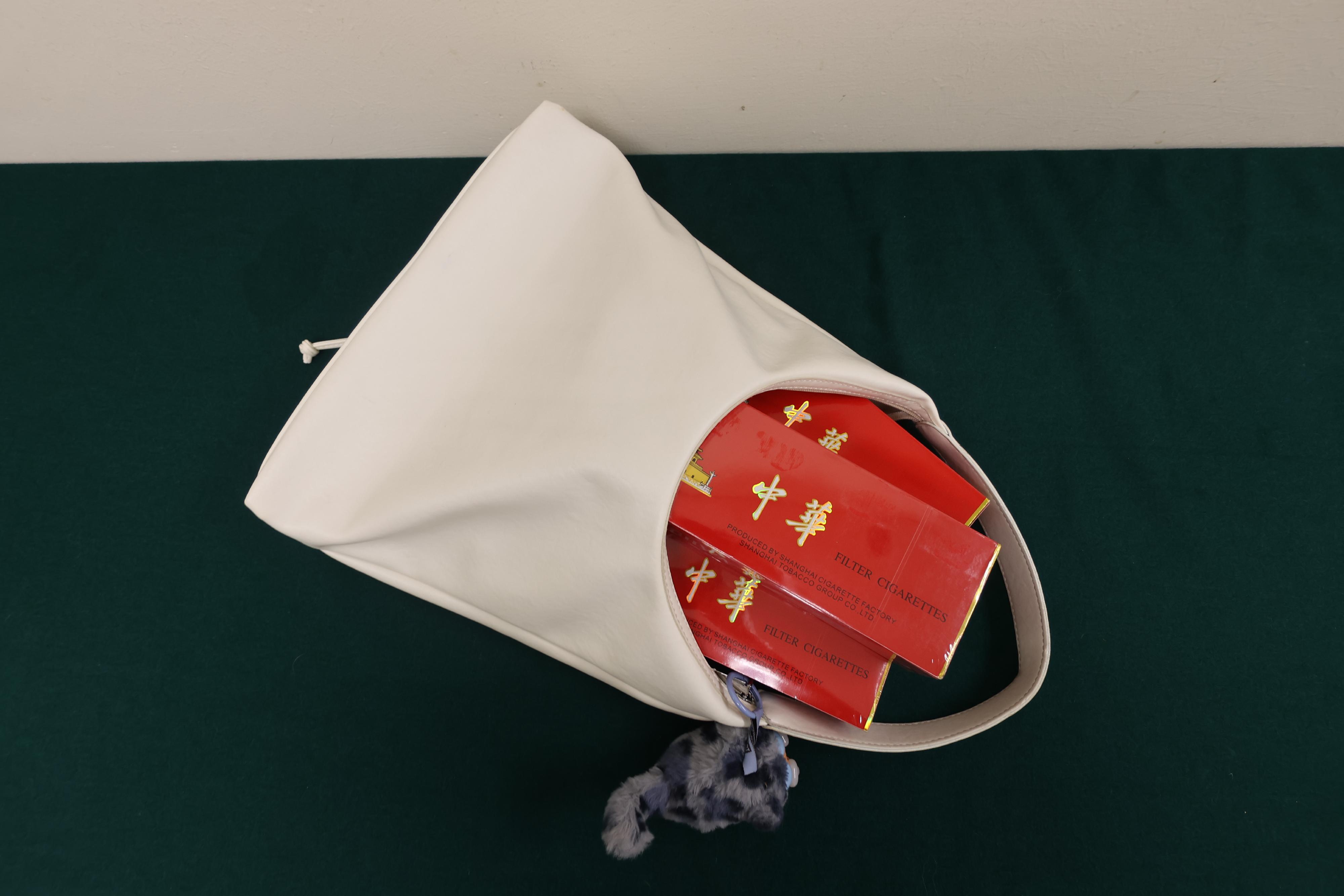An incoming local female passenger was sentenced to four weeks' imprisonment and fined $1,000 by the Fanling Magistrates' Courts today (July 10) for possessing duty-not-paid cigarettes and failing to declare them to Customs officers, in contravention of the Dutiable Commodities Ordinance. Photo shows the duty-not-paid cigarettes seized.